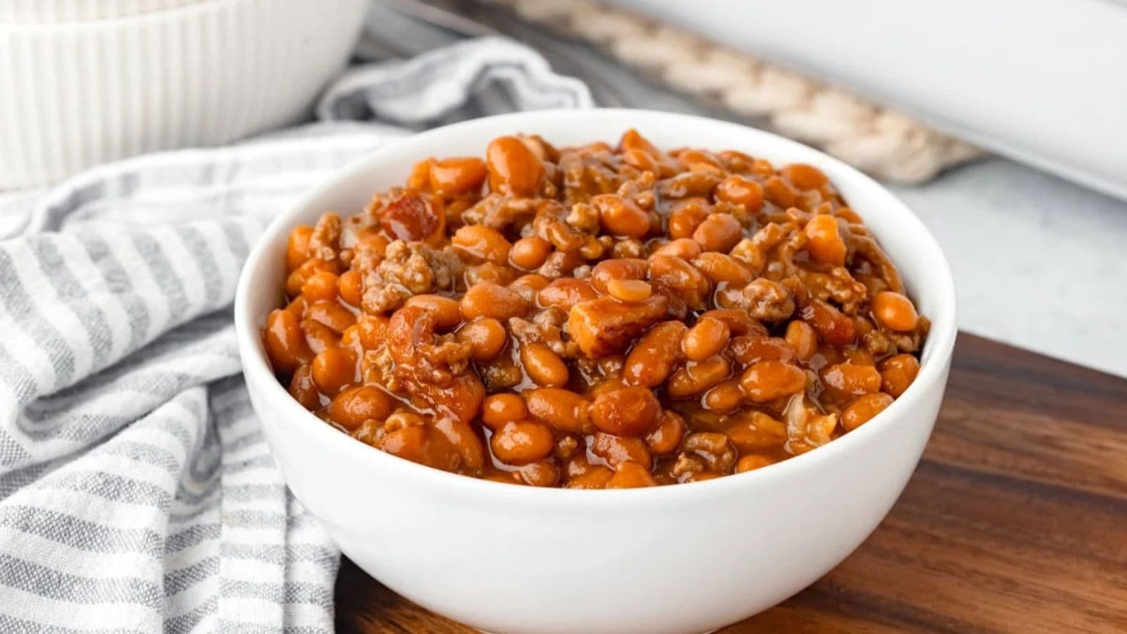Baked beans cooked with seasoned ground beef in a rich, savory sauce.