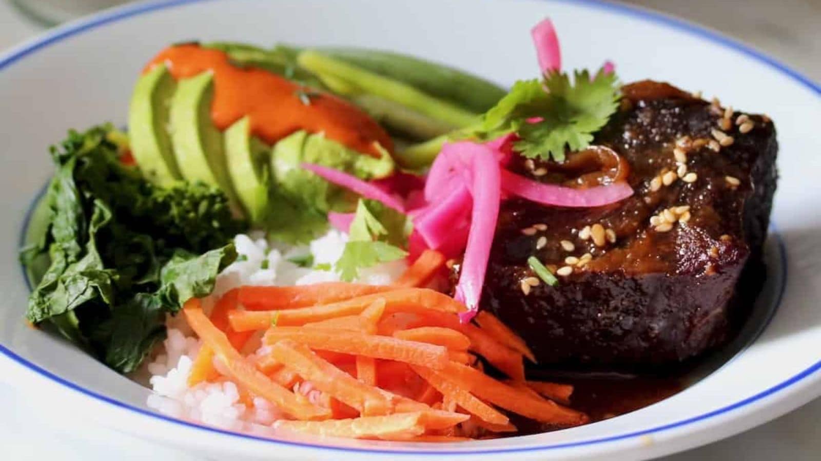 Short rib bowls topped with grilled beef and served over rice.
