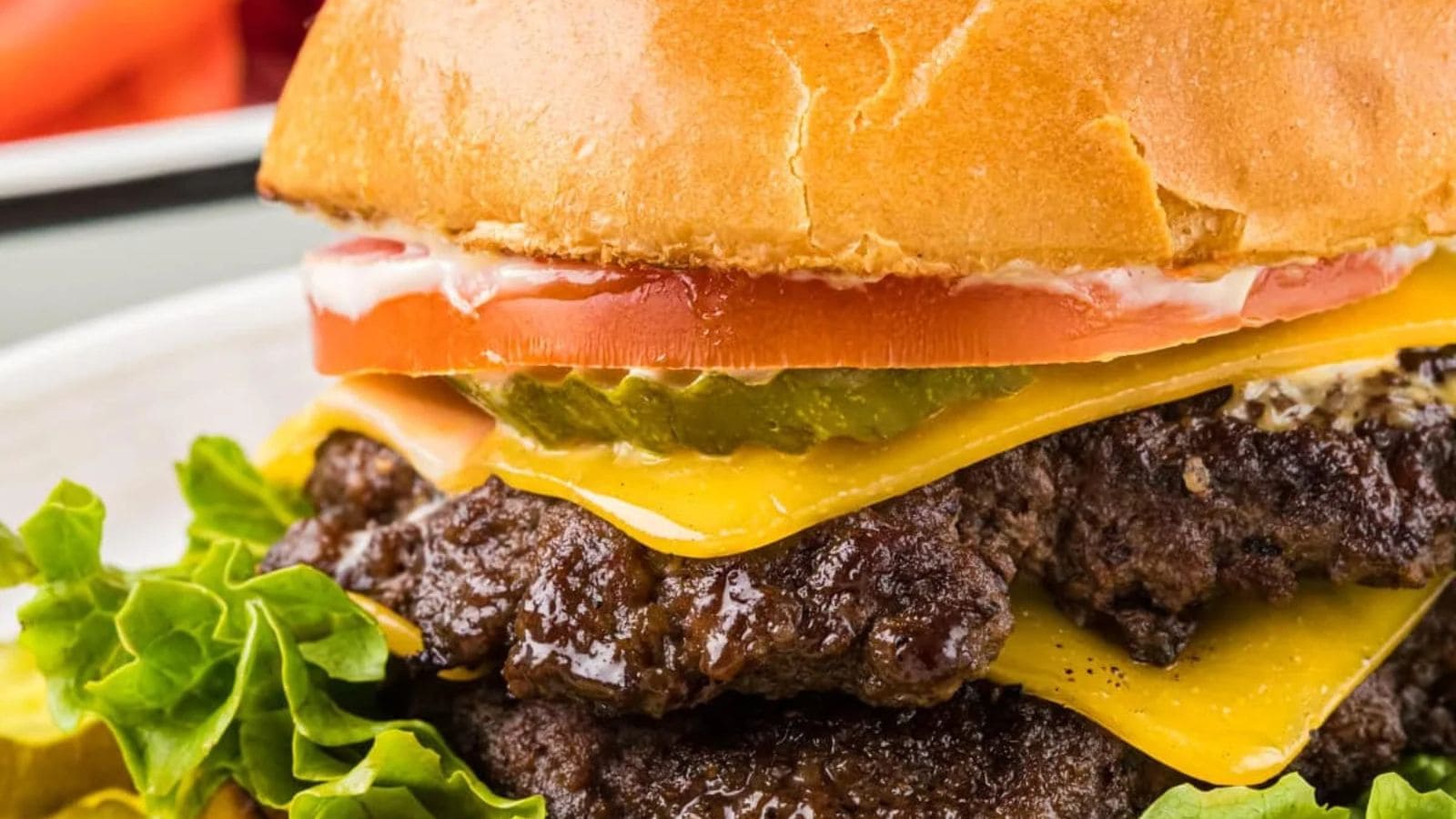 Smashburgers cooked with crispy edges, melted cheese, and toasted burger buns.