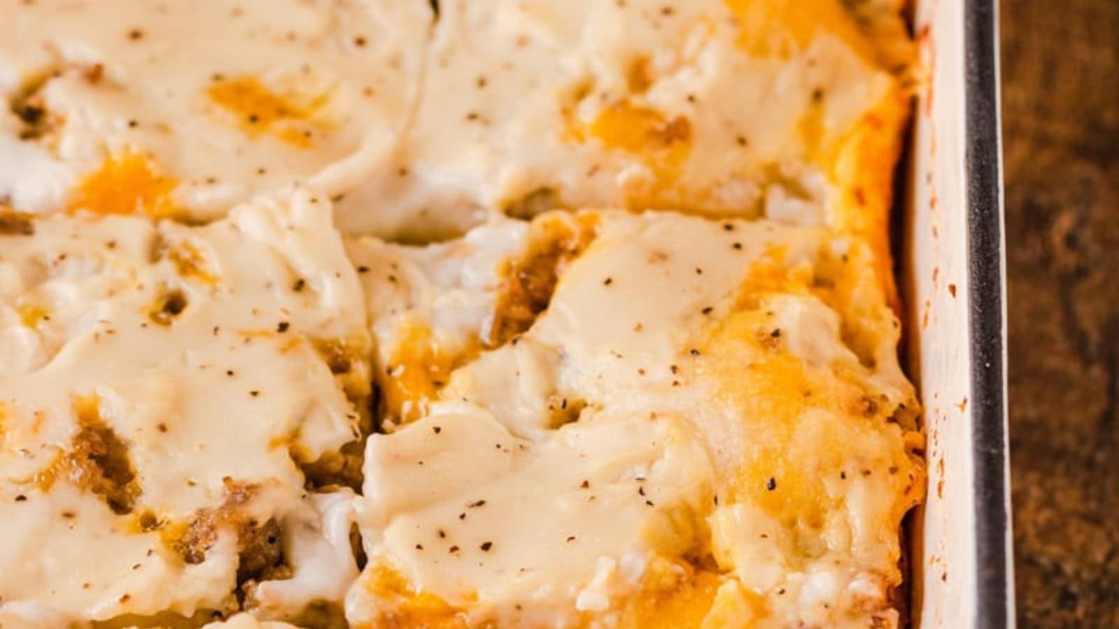 Breakfast casserole layered with biscuits and creamy sausage gravy.