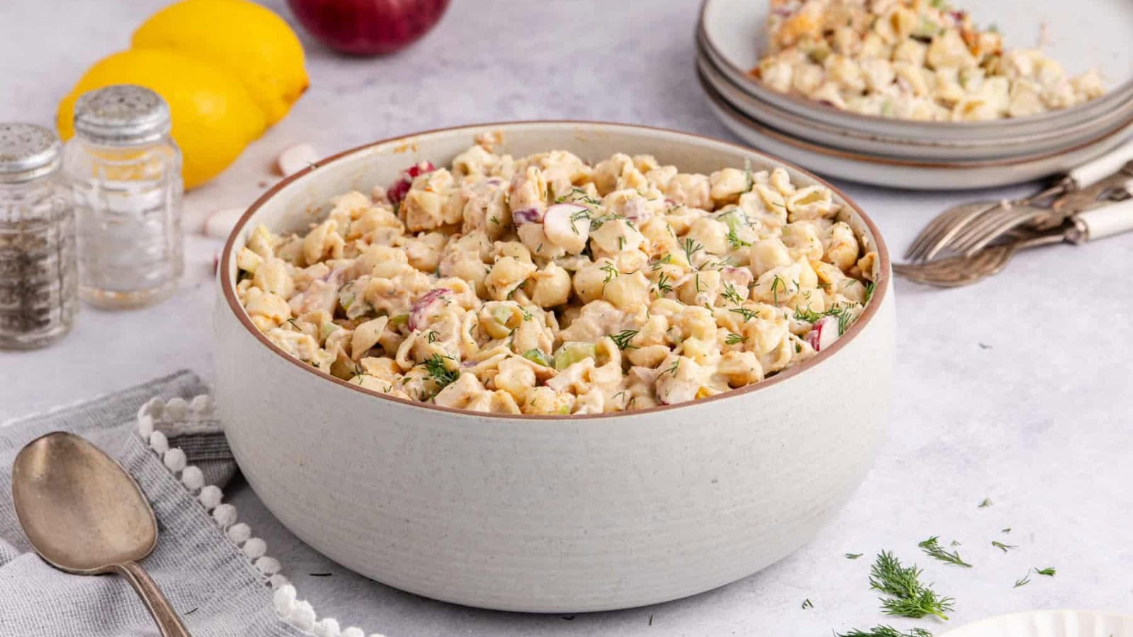 Tuna pasta salad mixed with pasta, vegetables, and creamy dressing.