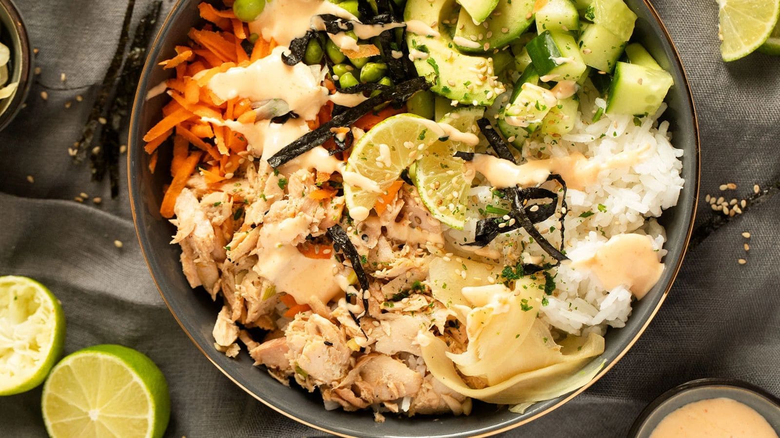 Salmon poke bowl layered with rice, salmon, and fresh toppings.