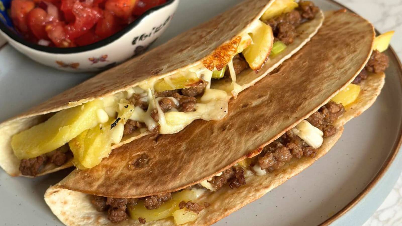Ground beef tacos filled with seasoned meat and fresh toppings.