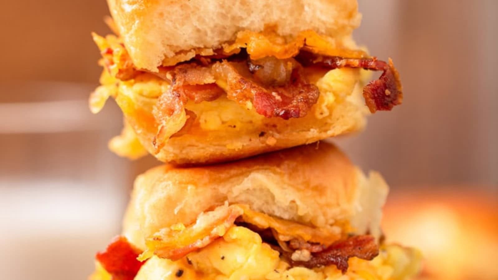 Breakfast sliders filled with eggs, cheese, and savory breakfast meat.
