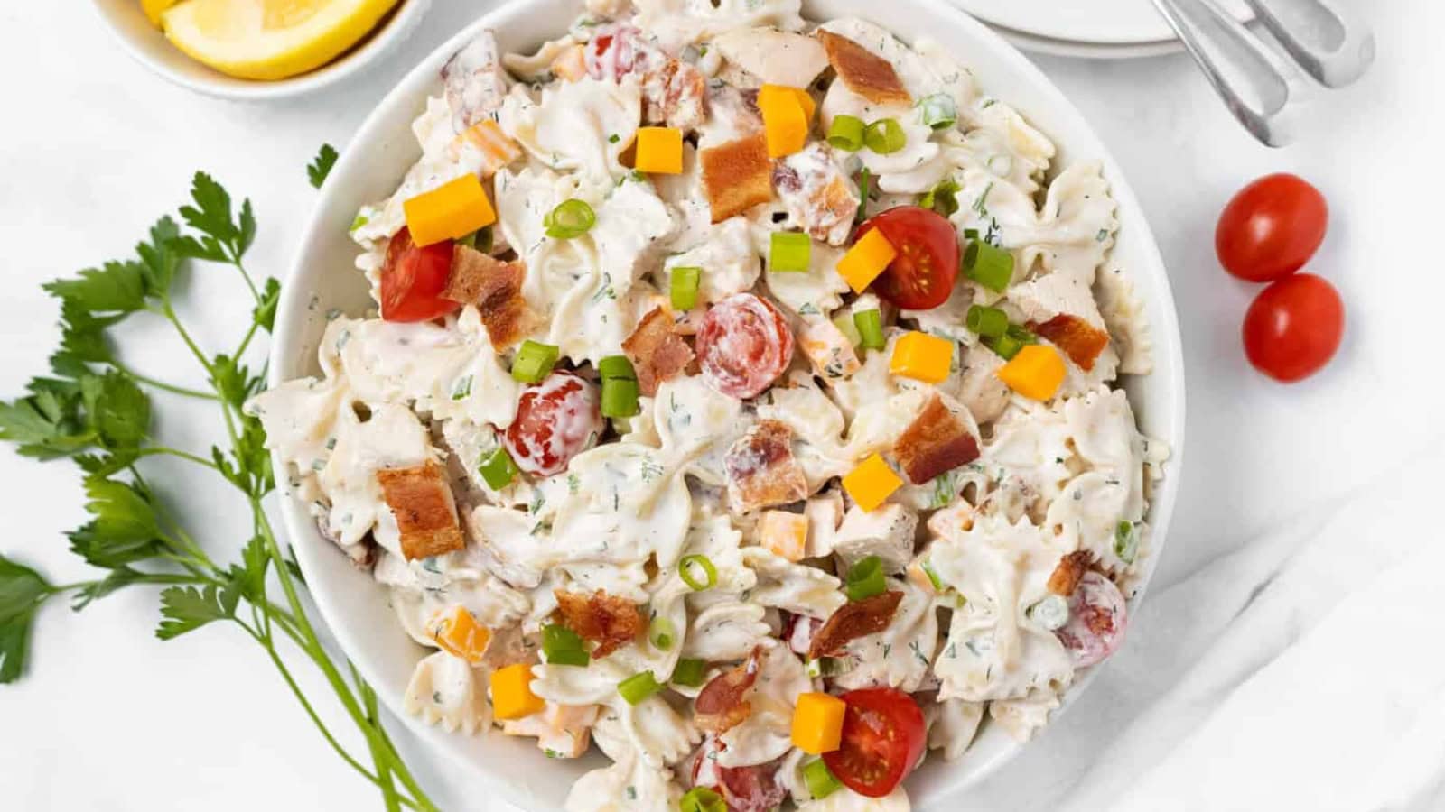Pasta salad tossed with bacon, tomatoes, and ranch dressing.