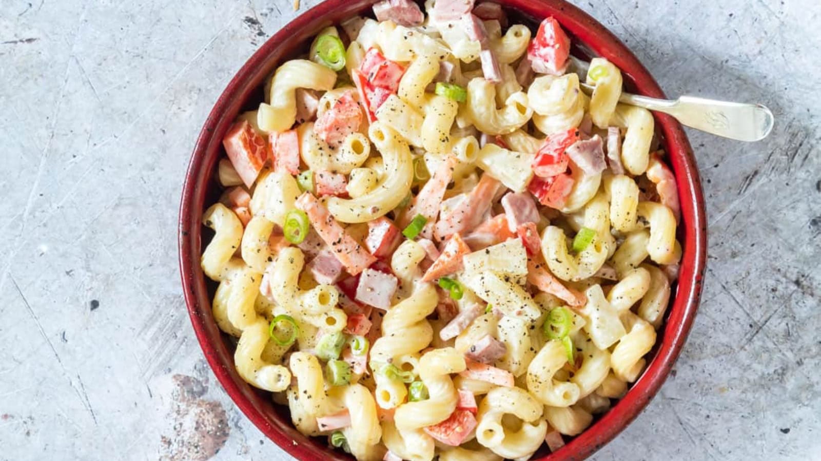 Hawaiian pasta salad mixed with pasta, vegetables, and creamy dressing.