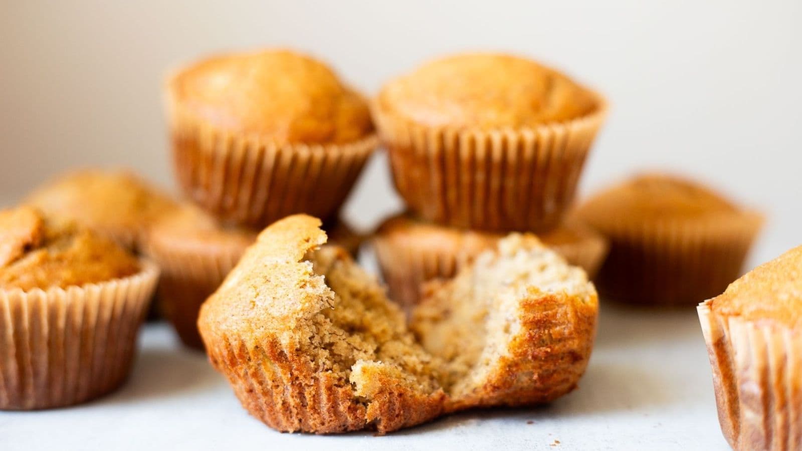 Banana muffins made with sourdough discard and baked moist with golden tops.