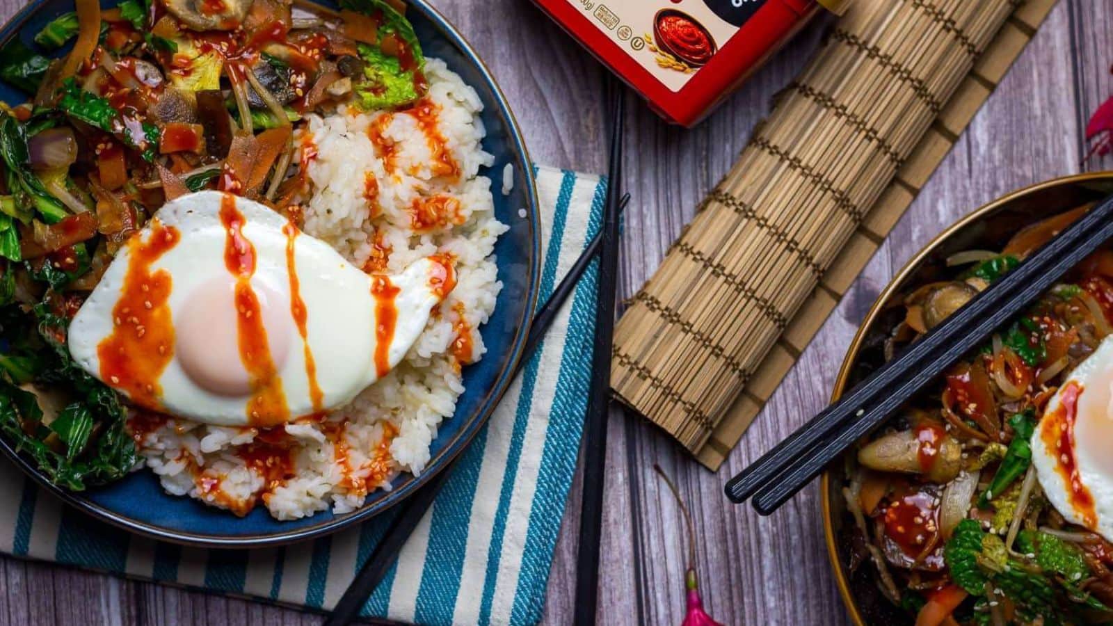 Vegetarian bibimbap topped with rice, vegetables, and flavorful sauce.