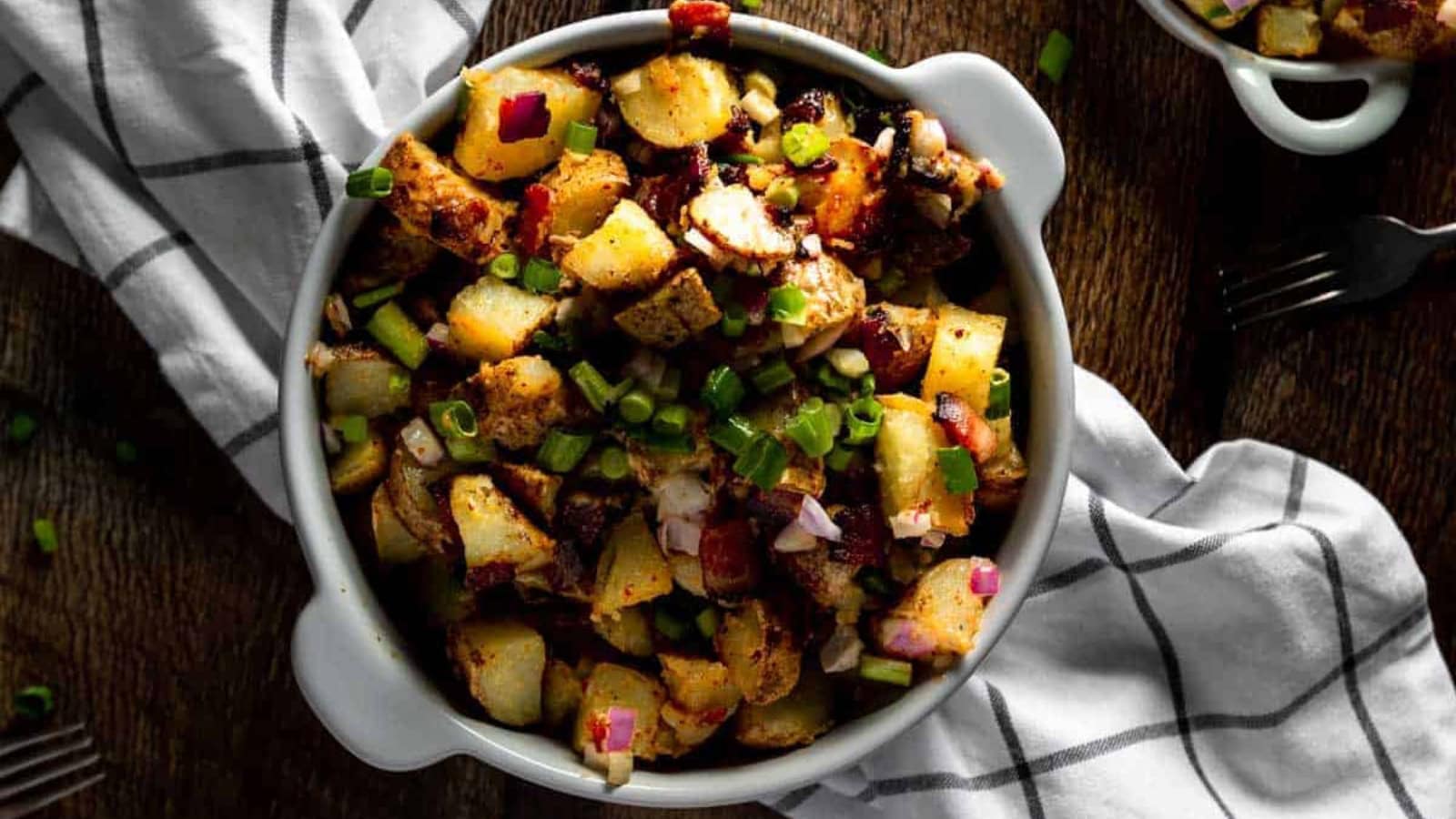 Fried potato salad tossed with bacon and creamy aioli dressing.