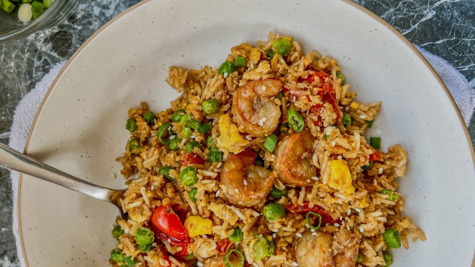 Shrimp fried rice cooked with garlic and tender seasoned rice.