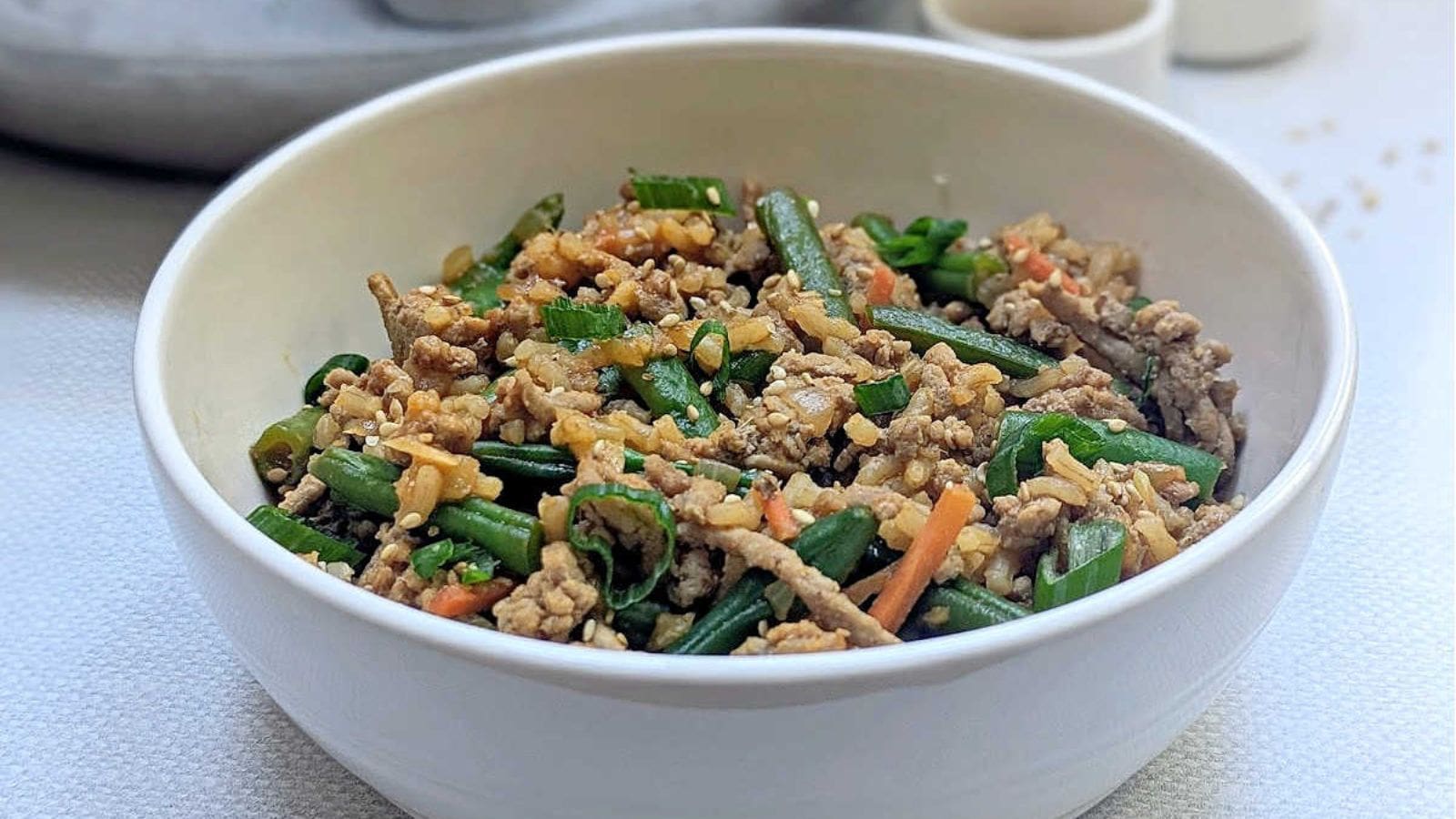 Ground turkey rice skillet cooked with green beans and coated in spicy gochujang sauce.