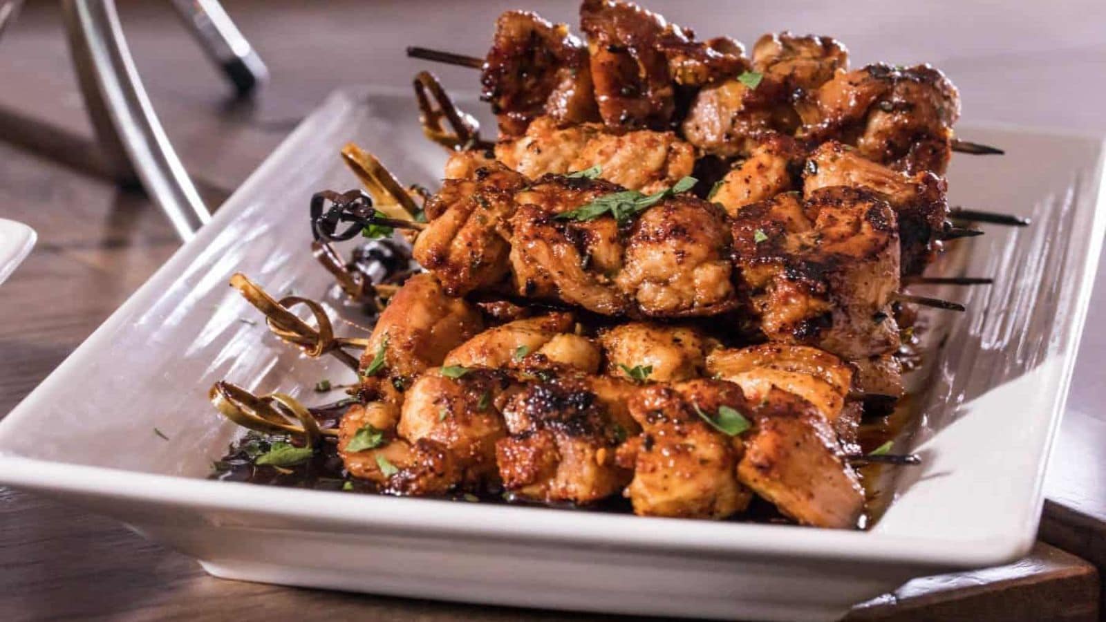 Chicken thigh skewers grilled with smoky edges and tender meat.
