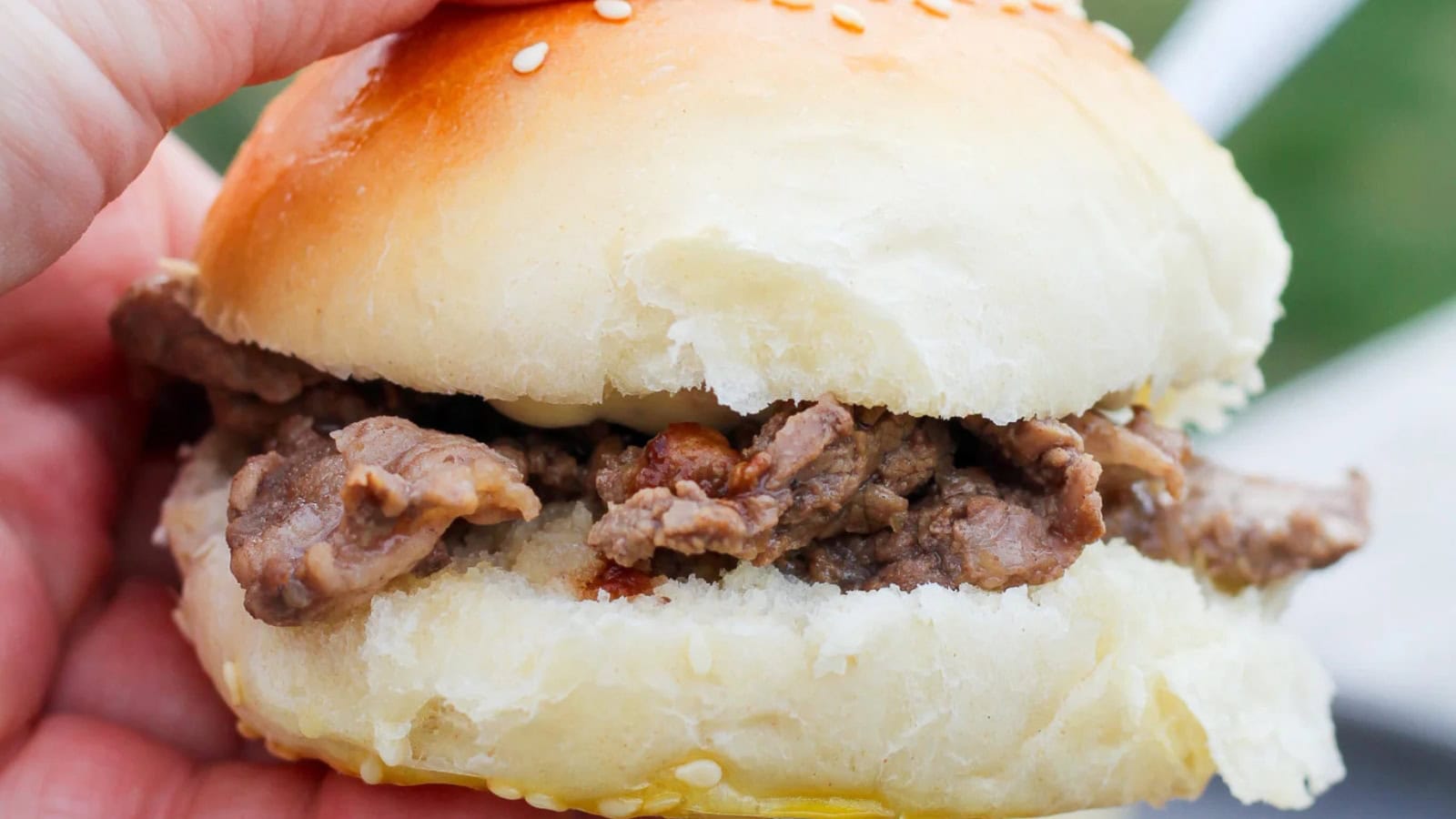 Steak sandwich layered with grilled beef and creamy garlic aioli.