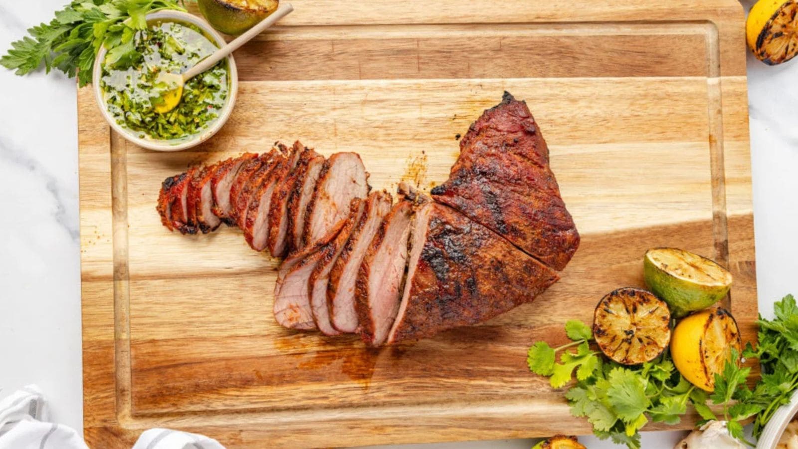 Tri-tip steak grilled with a browned crust and tender slices.