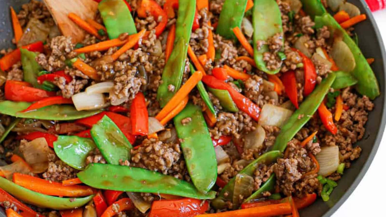 Ground beef stir fry mixed with vegetables and tender beef crumbles.