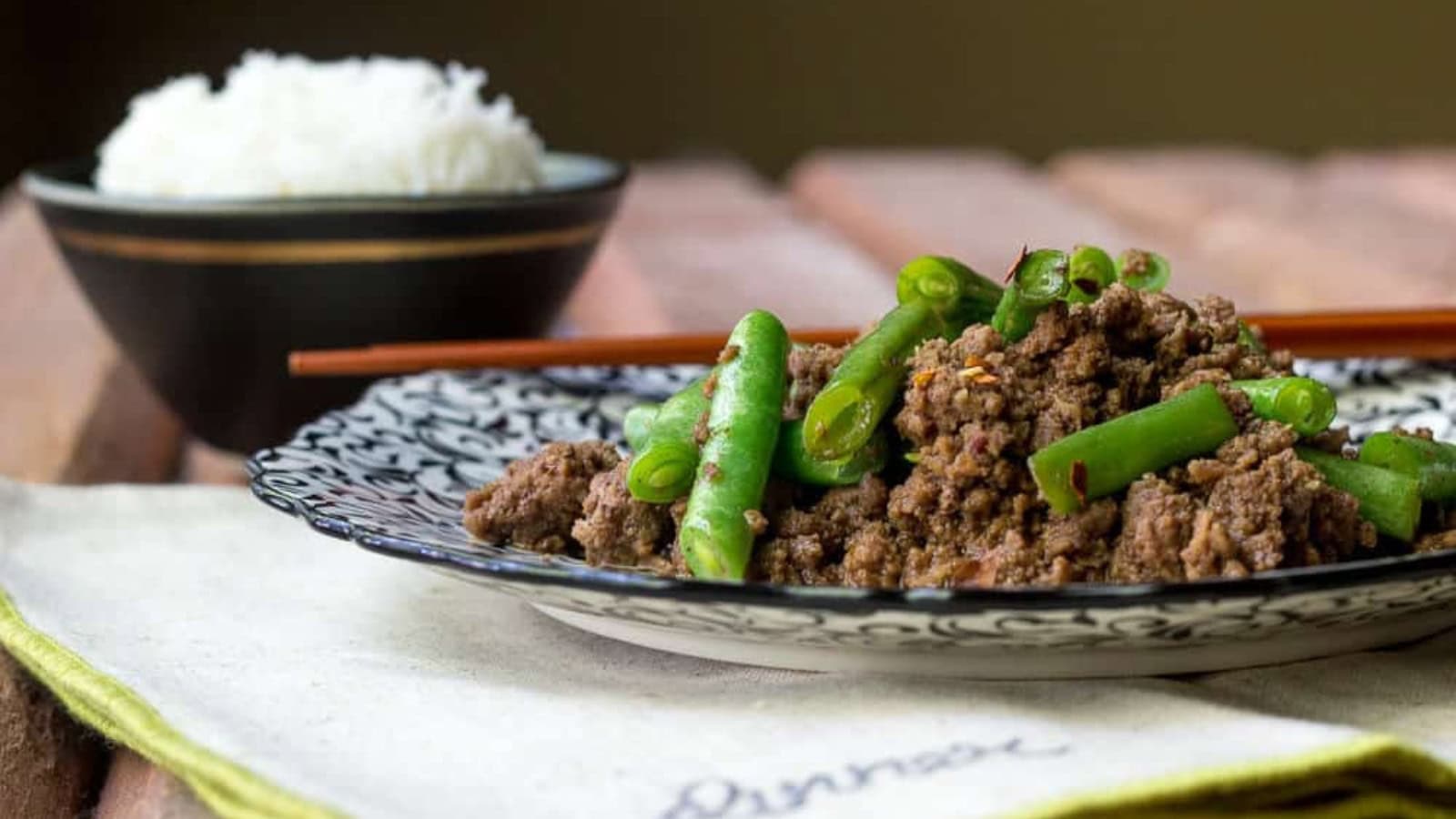 Beef stir fry tossed with green beans in a savory sauce.