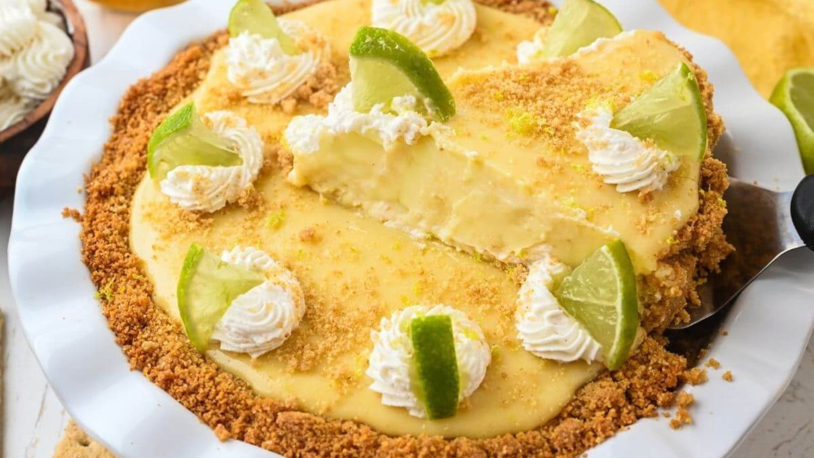 Key lime pie with creamy citrus filling in a graham crust.