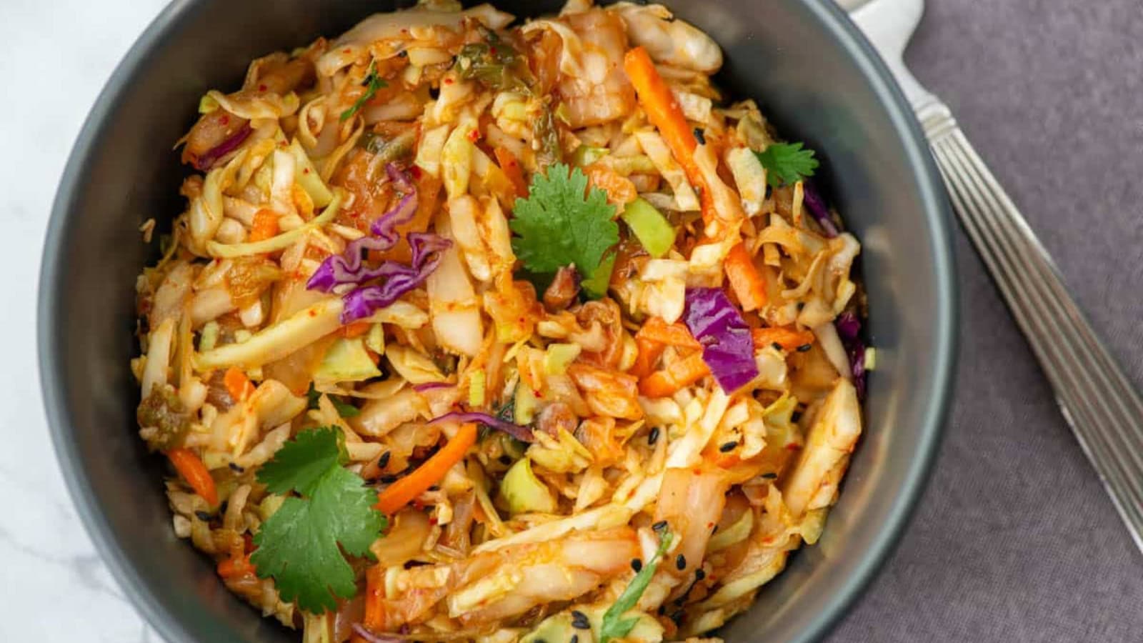 Kimchi slaw mixed with cabbage and spicy fermented seasoning.