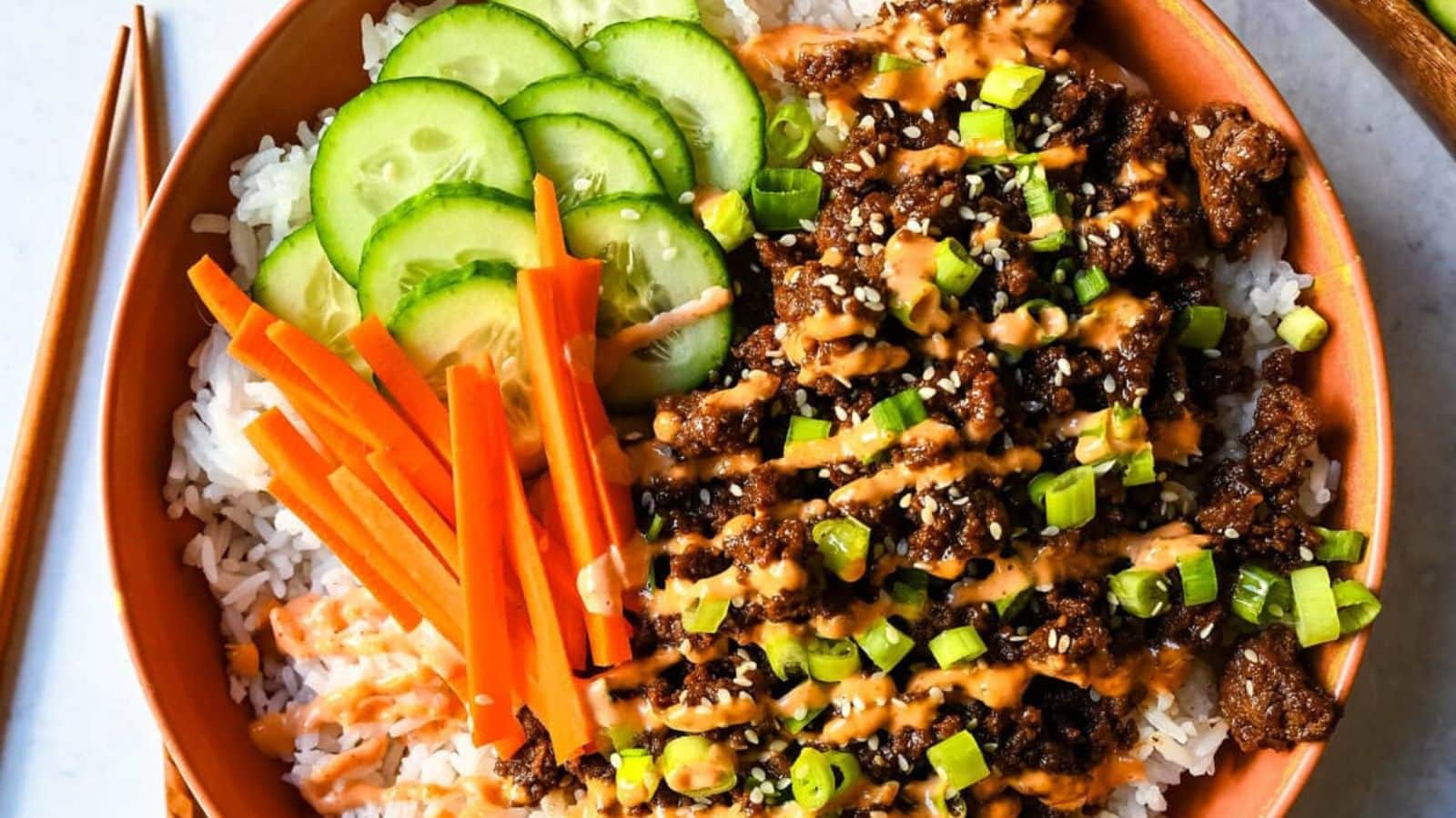Korean beef bowls topped with seasoned beef and served over rice.