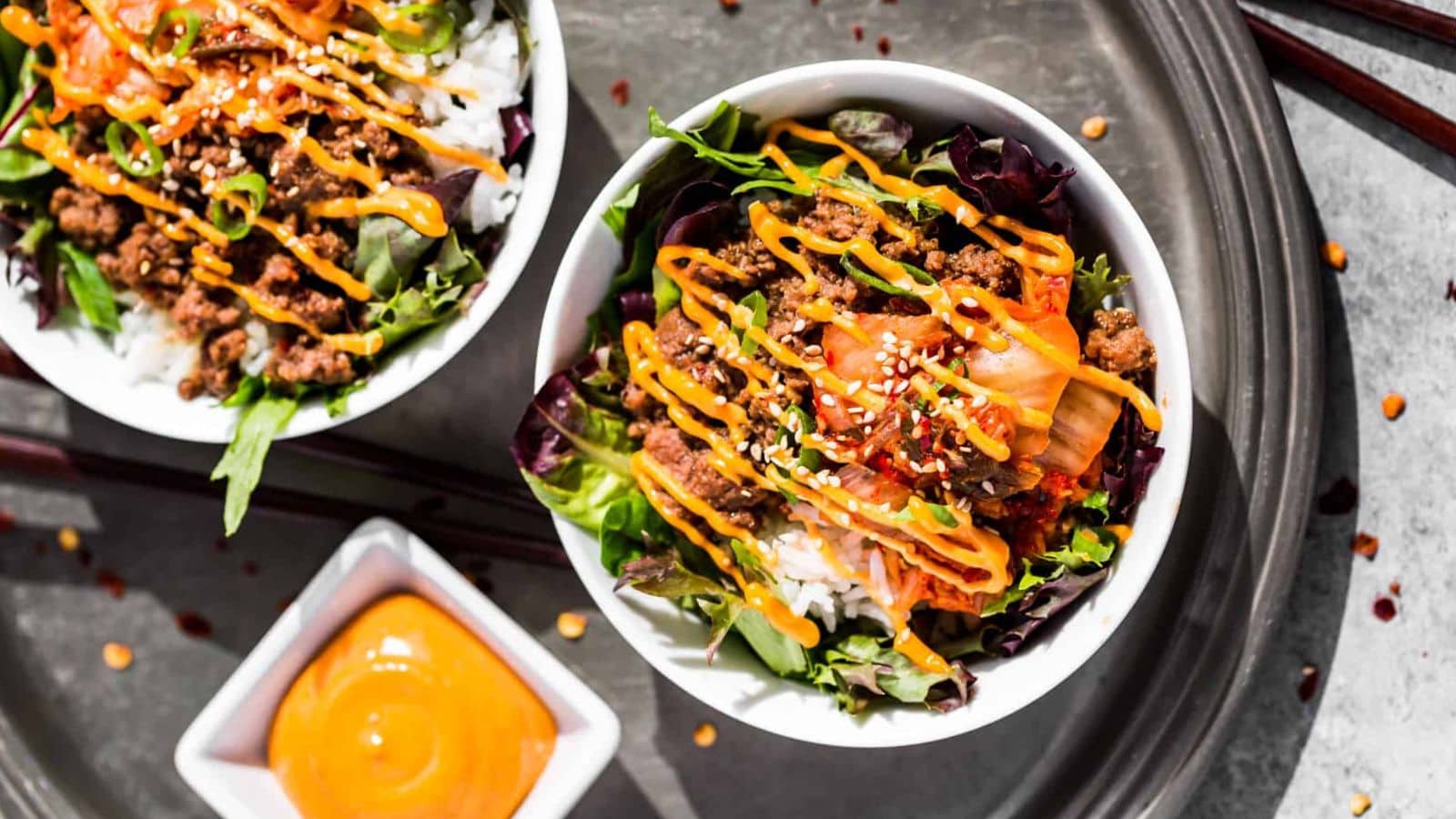 Korean beef bowls layered with rice and savory seasoned beef.