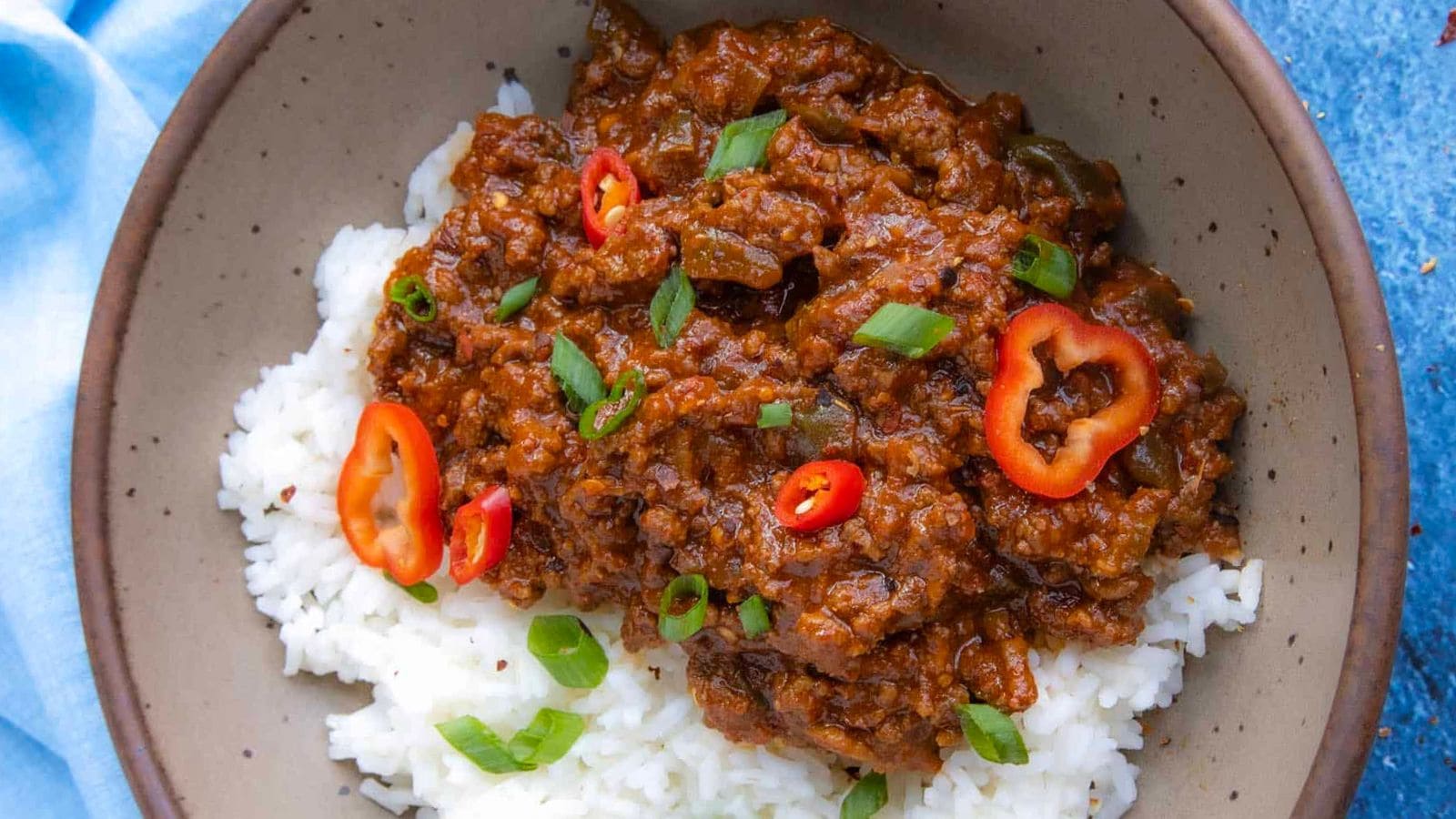 Ground beef bowls coated in spicy gochujang sauce and served with rice.