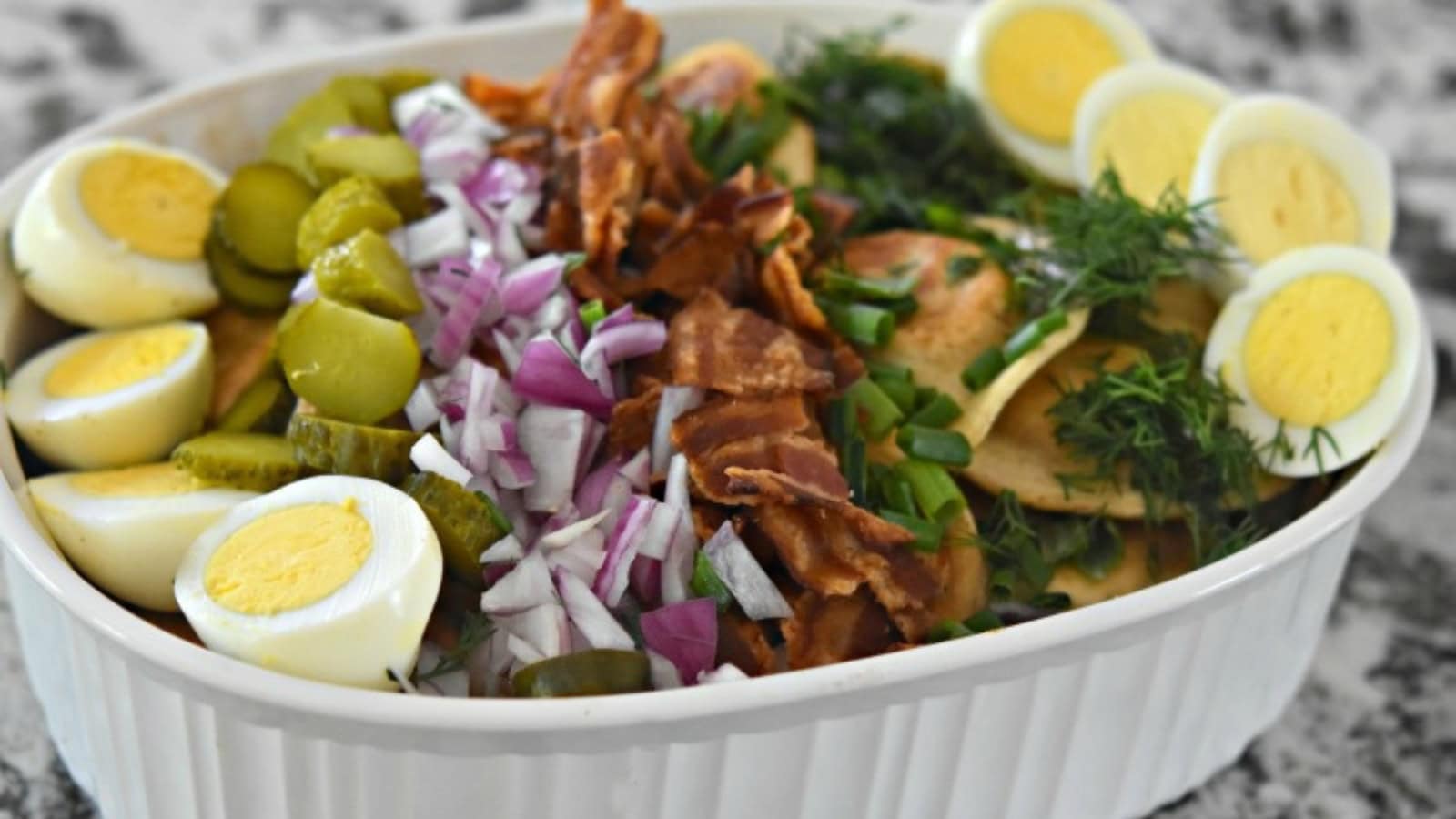 Potato salad mixed with pierogi flavors, bacon, and creamy dressing.