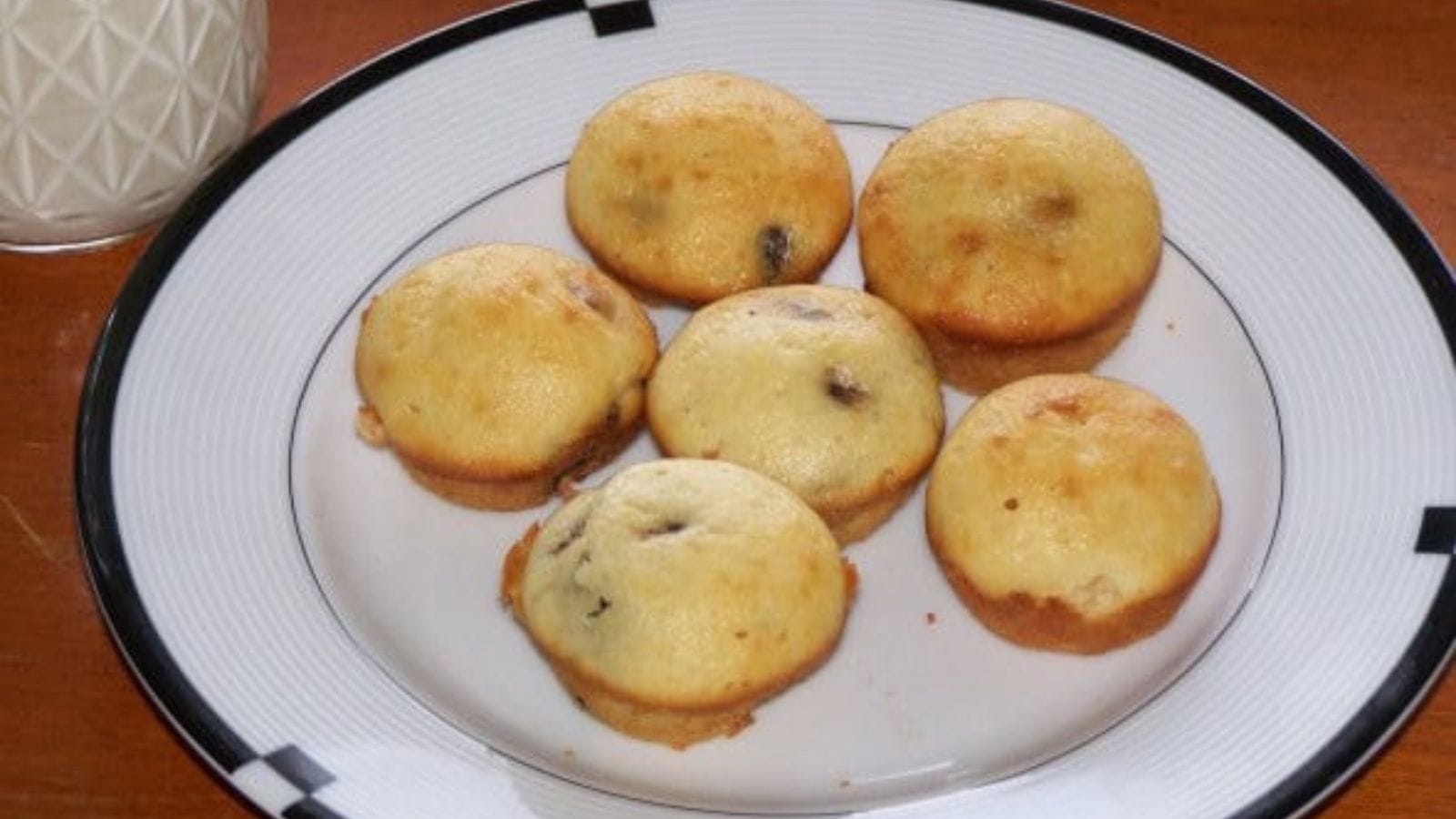 Mini chocolate chip muffins with fluffy texture and melted chocolate pieces.