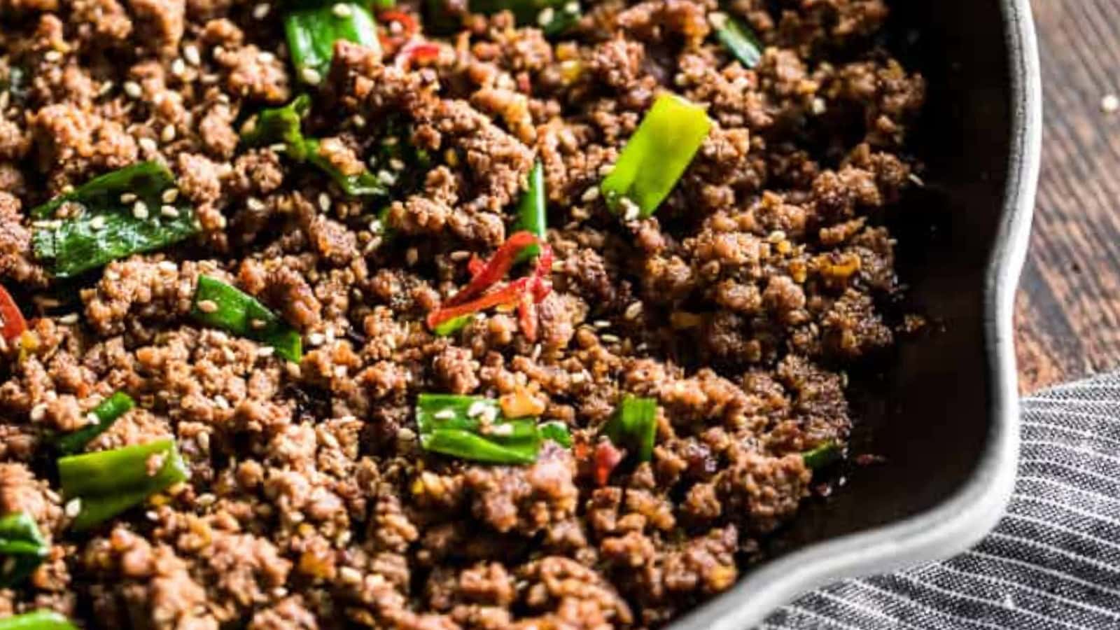 Mongolian beef coated in savory sauce with tender beef slices.