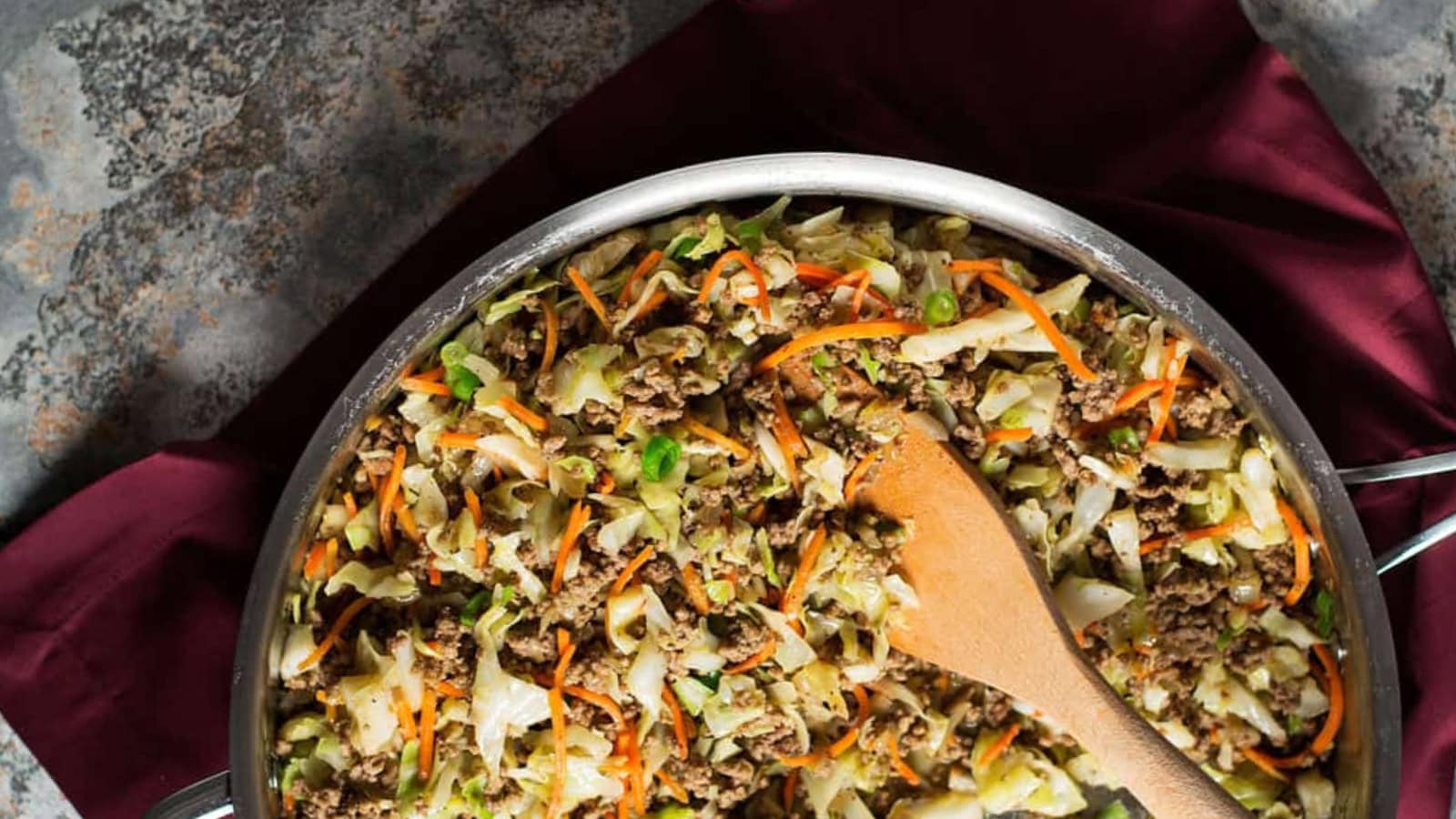 Egg roll bowl cooked with cabbage, ground meat, and savory seasoning.