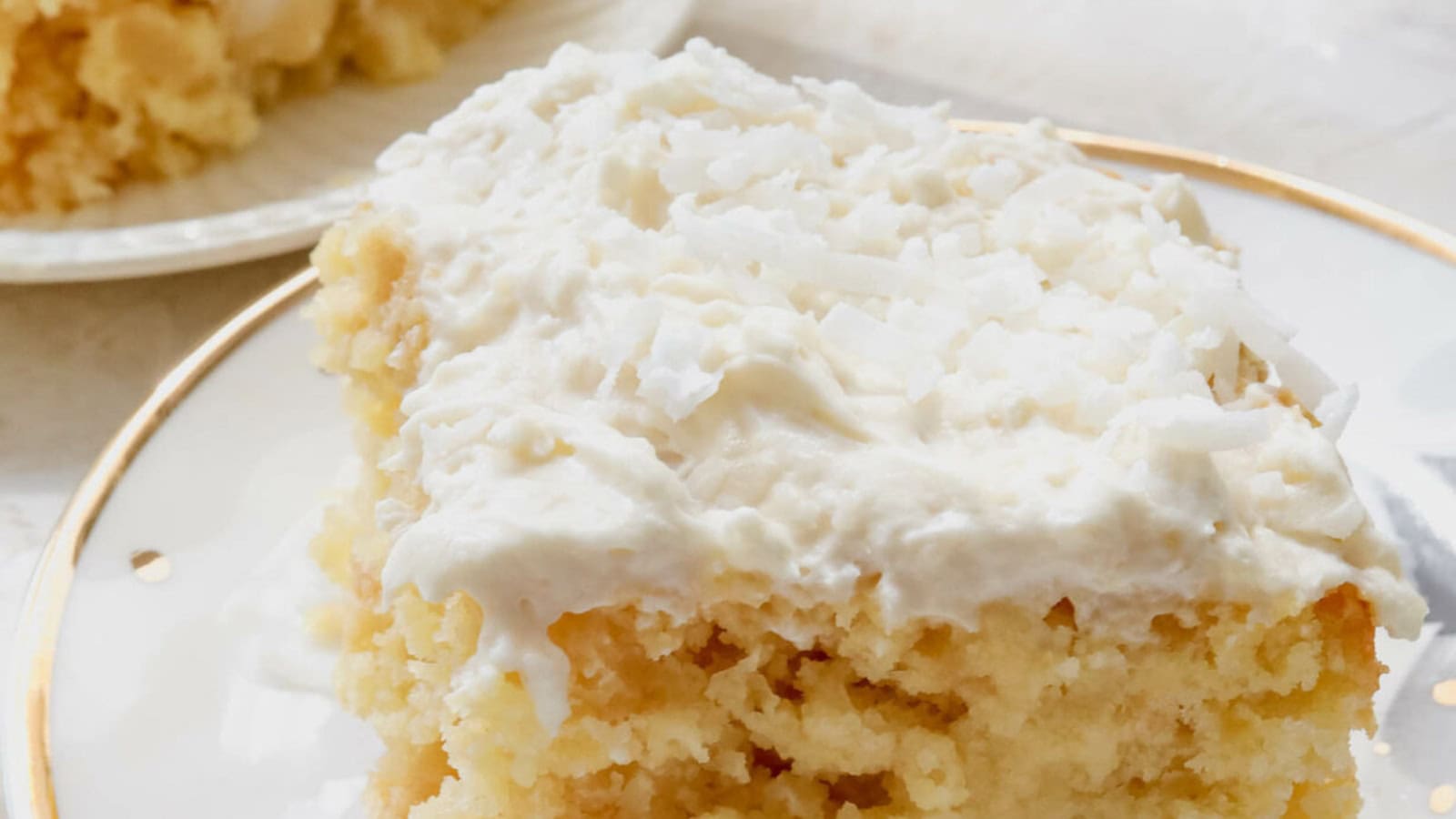 Poke cake filled with pineapple flavor and whipped topping.