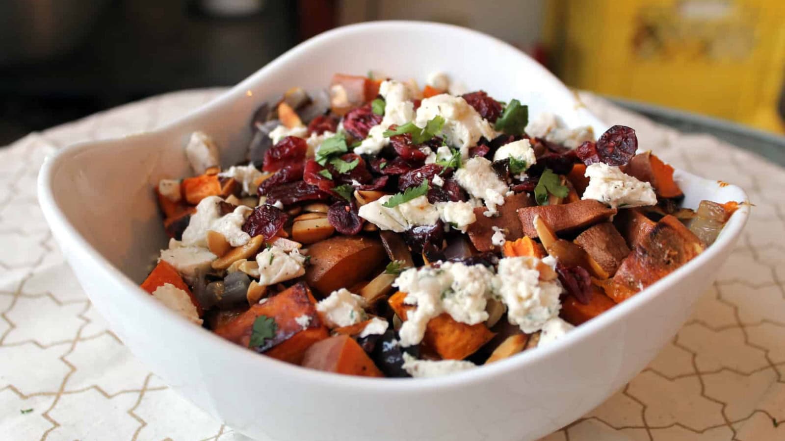 Sweet potato salad mixed with roasted chunks and fresh herbs.