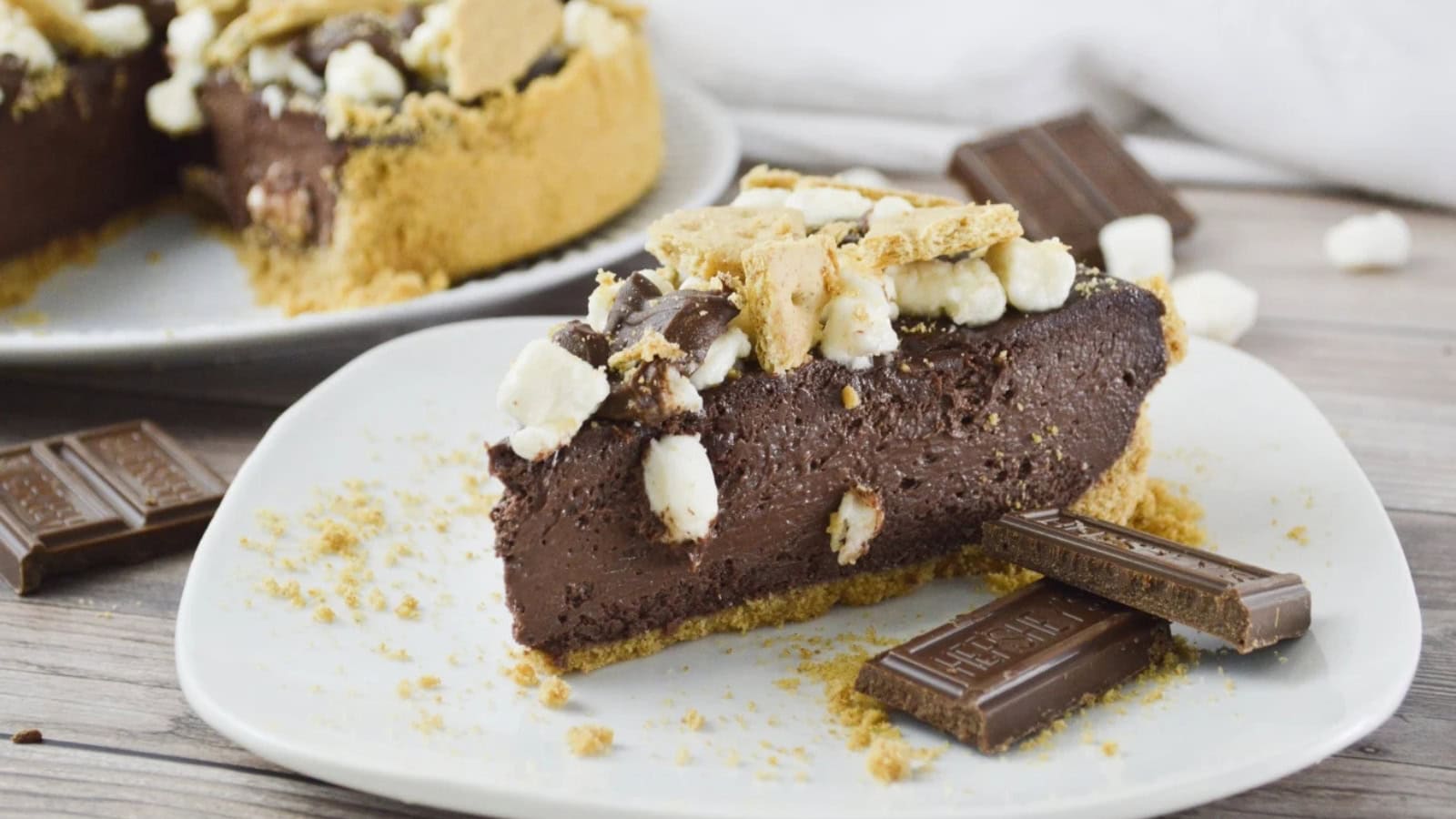 Chocolate cheesecake topped with s’mores ingredients and toasted marshmallows.