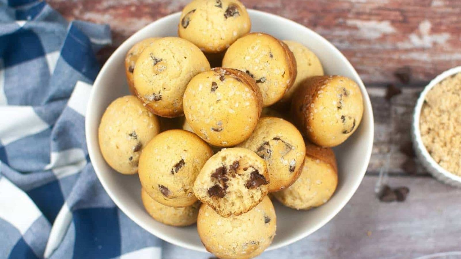 Chocolate chip muffins made with sourdough discard and golden muffin tops.