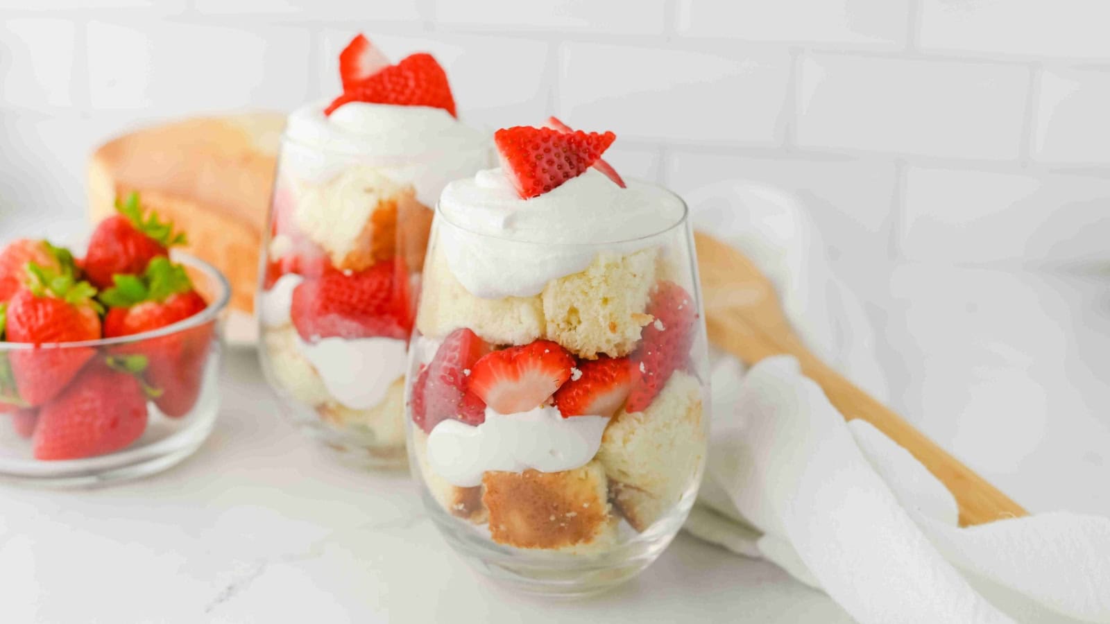 Strawberry parfait layered with pound cake, berries, and whipped topping.