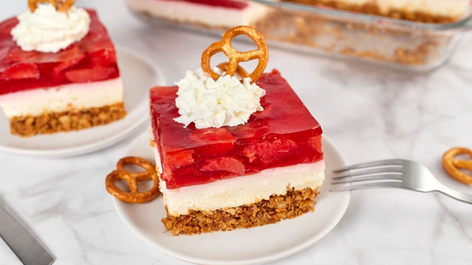 Strawberry pretzel salad layered with creamy filling and crunchy pretzel crust.