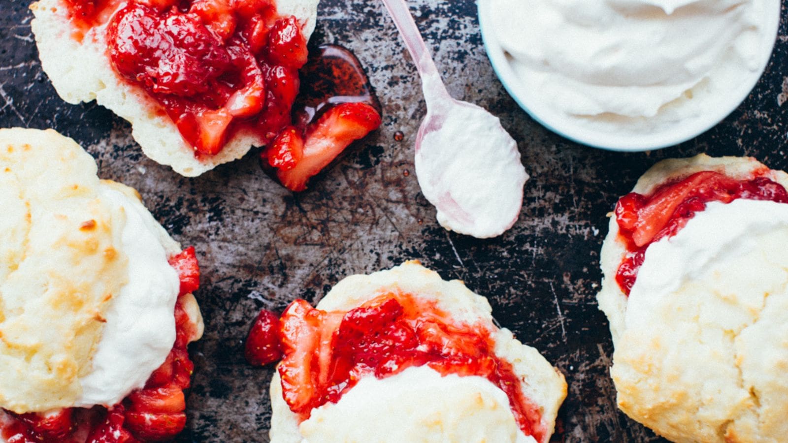 Strawberry shortcakes topped with fresh berries and fluffy biscuits.