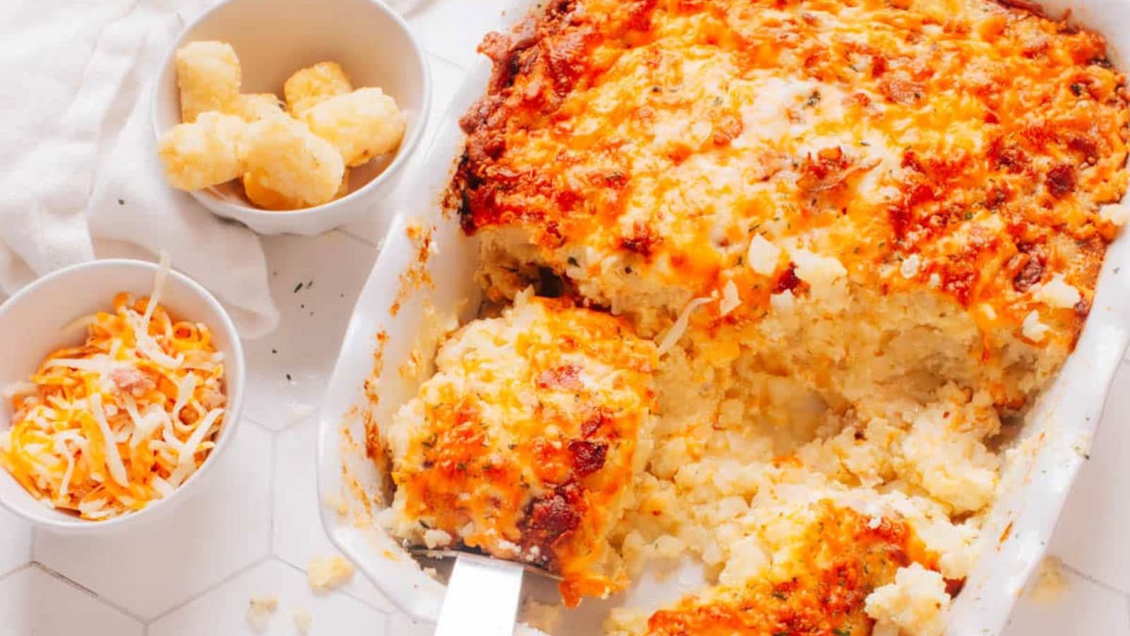 Breakfast casserole topped with crispy tater tots and melted cheese.