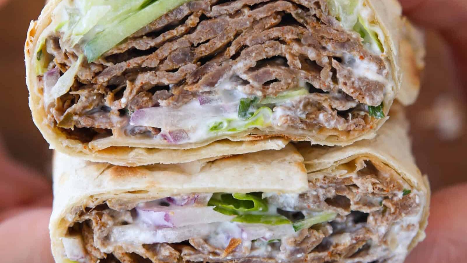 Doner kebab filled with seasoned meat and fresh toppings in warm bread.