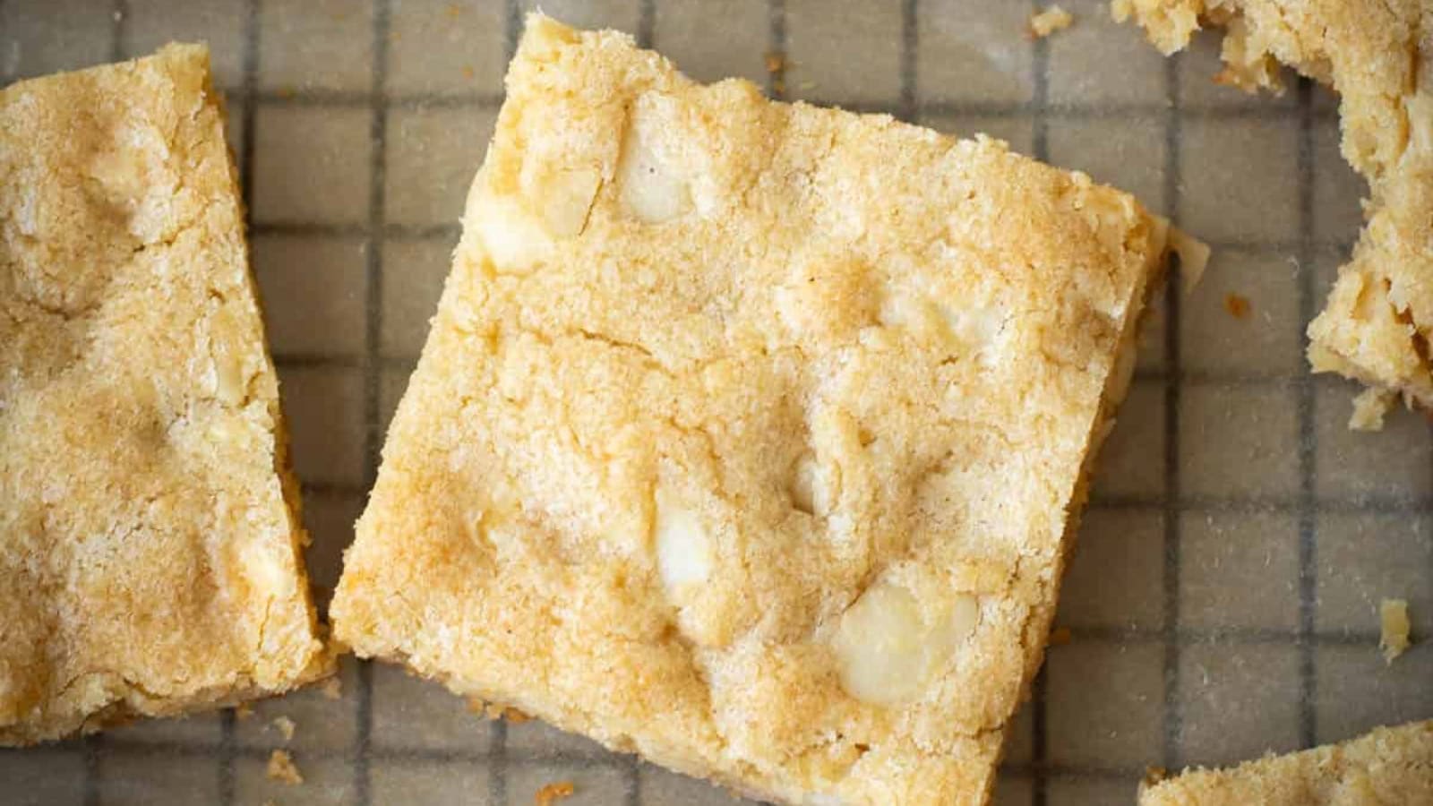 Dessert bars baked with white chocolate chips and macadamia nuts.