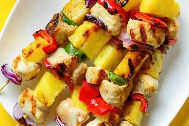 Chicken Kabobs with Pineapple on a white plate.