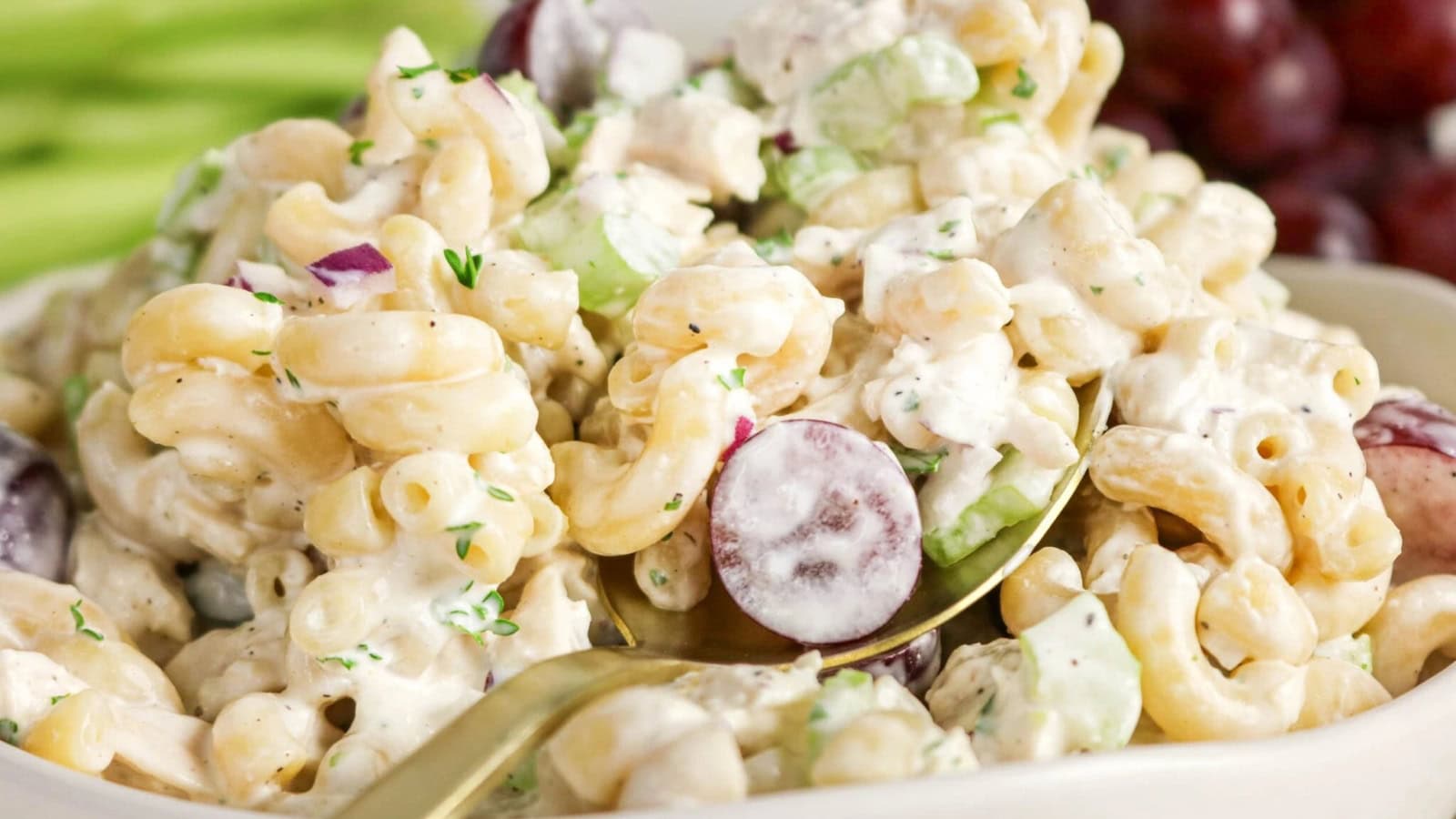 Pasta salad mixed with chicken, vegetables, and creamy dressing.