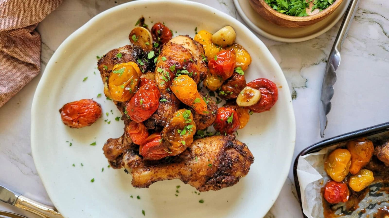 Chicken cooked with cherry tomatoes in a flavorful pan sauce.
