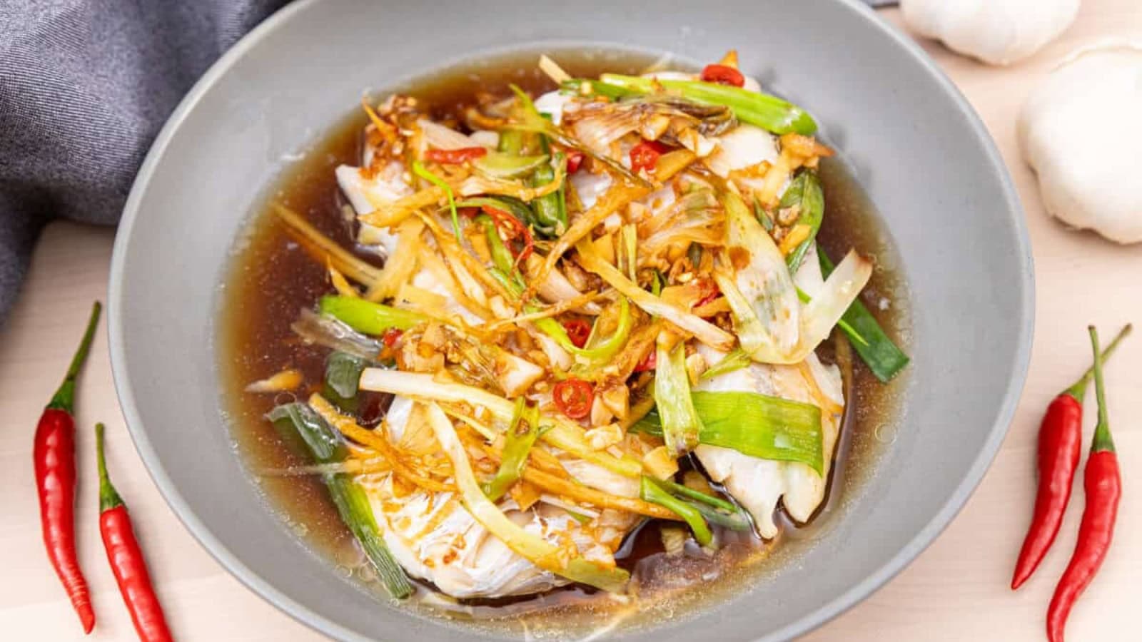 Steamed fish fillets topped with a savory soy ginger sauce.
