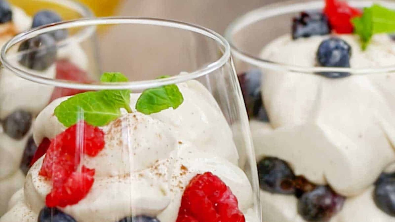 Berry cream parfaits layered with fresh berries and fluffy cream.