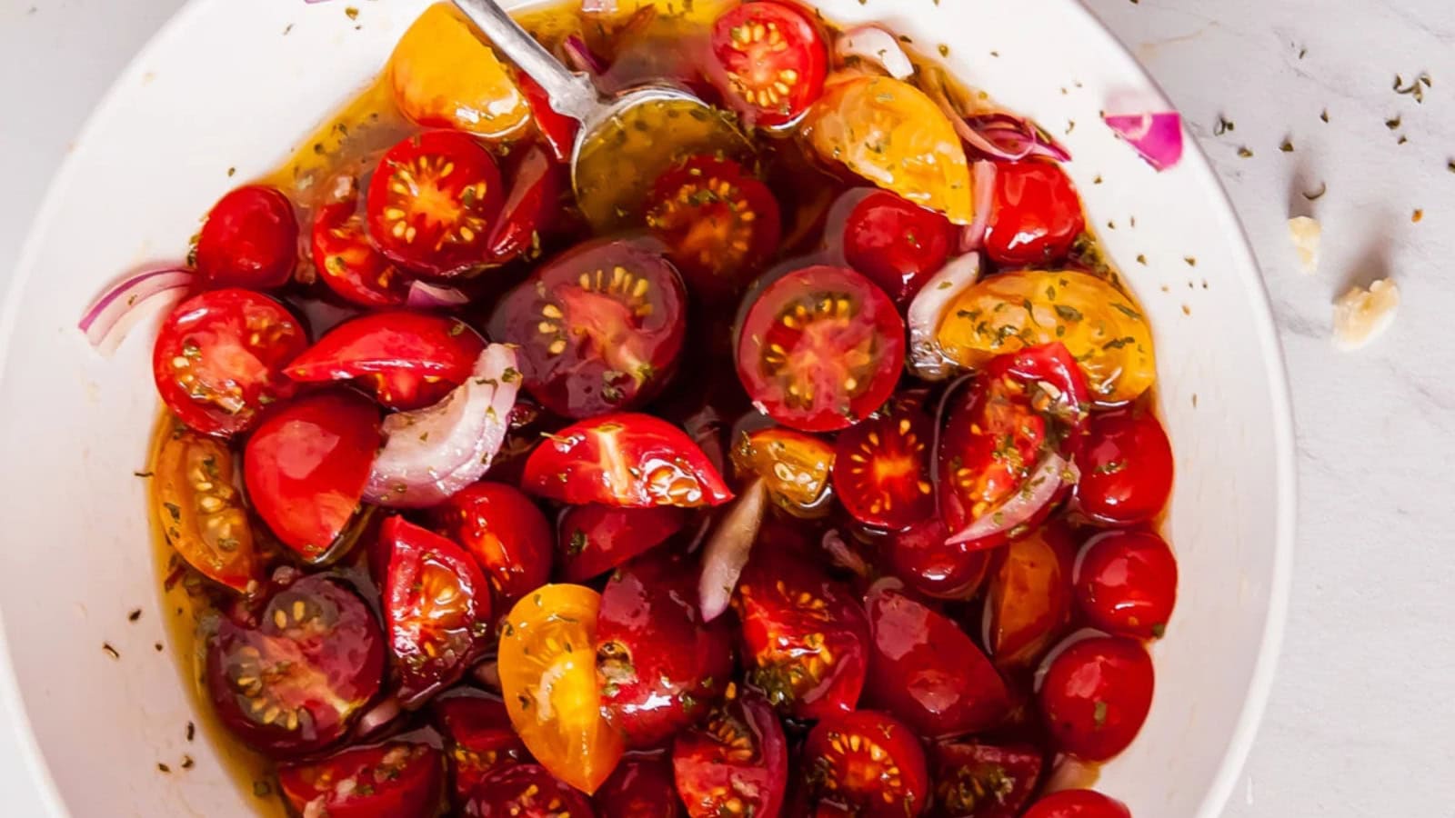 Fresh tomatoes marinated in herbs and a flavorful vinaigrette.