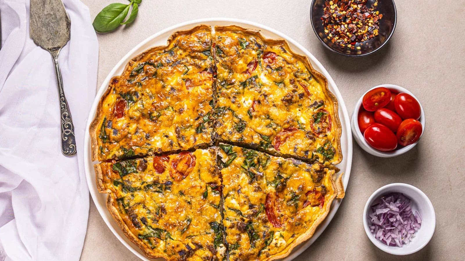 Tortilla quiche filled with eggs, vegetables, and protein-rich ingredients.