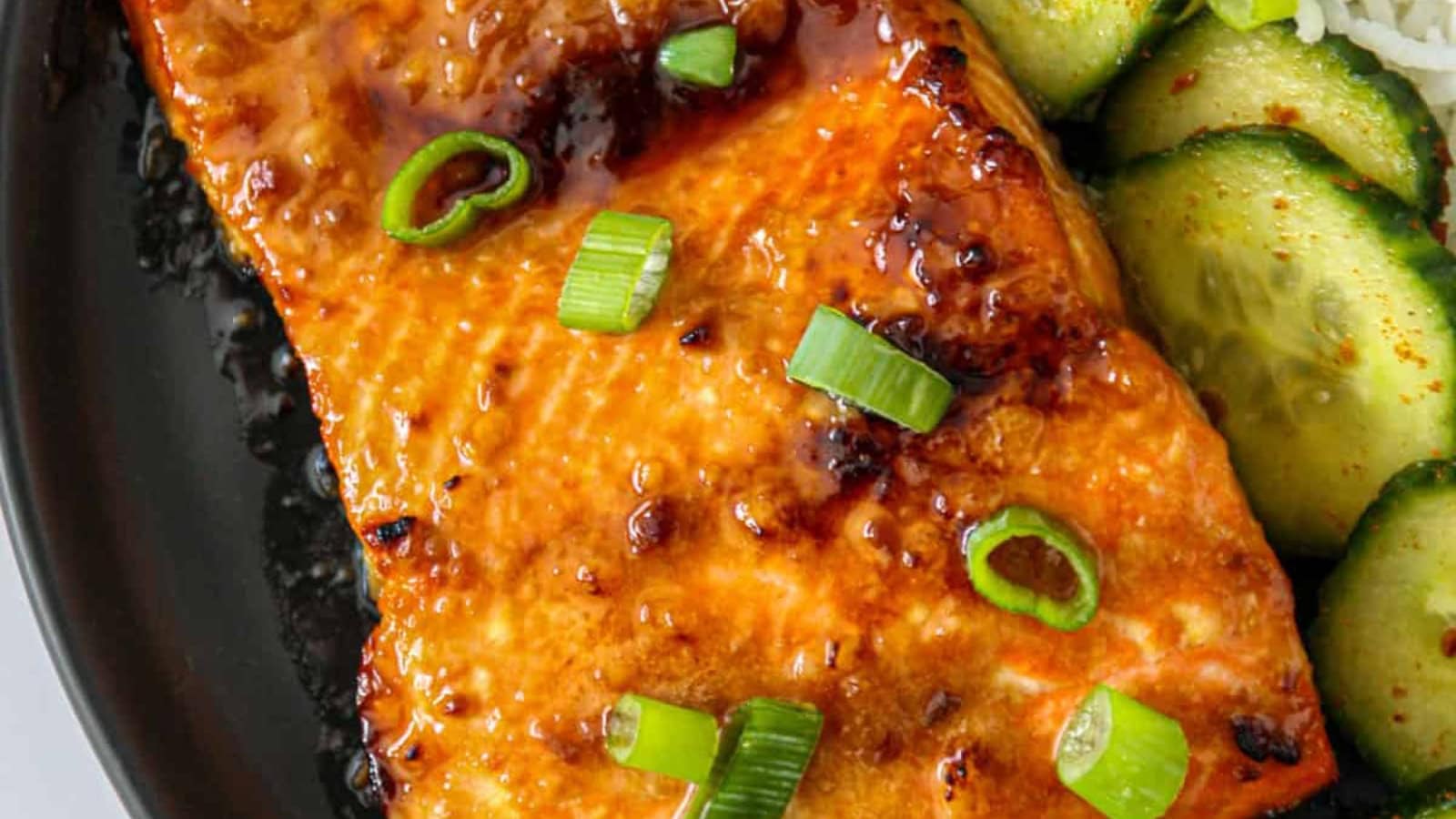 Salmon topped with a rich miso butter glaze and fresh herbs.