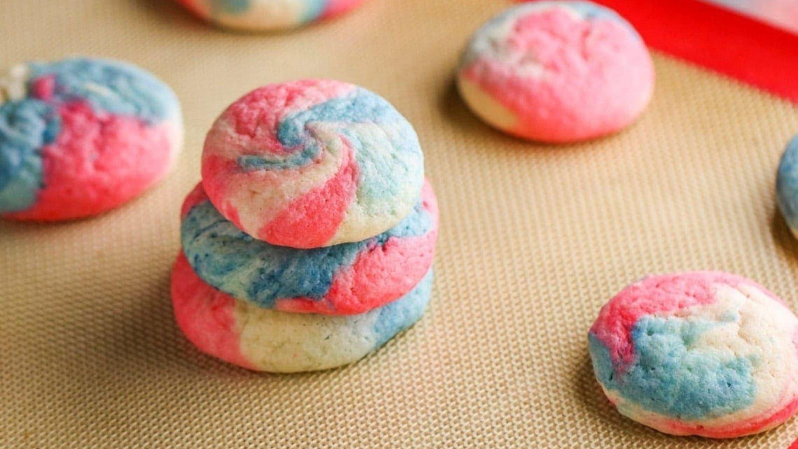 Soft cheesecake cookies topped with festive red, white, and blue decorations.