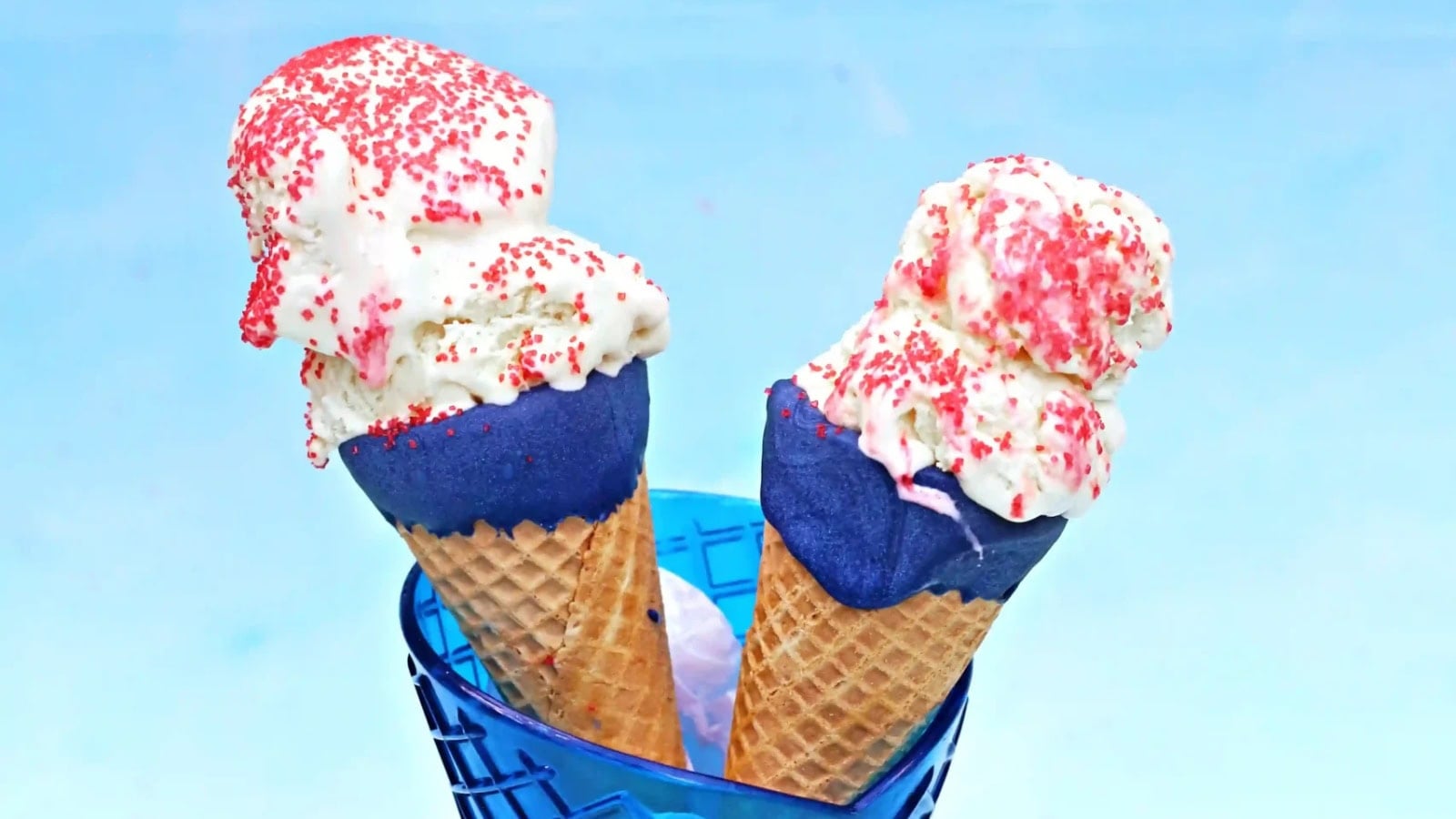 Ice cream cones decorated with festive red, white, and blue toppings.