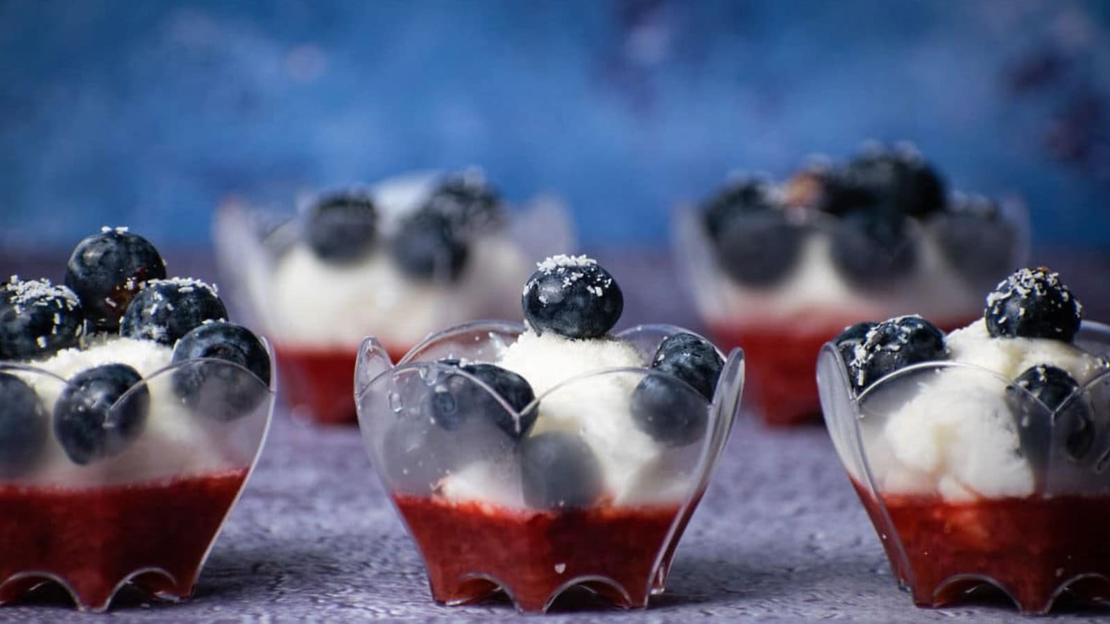 Layered fruit ice cream treat with vibrant red, white, and blue colors.